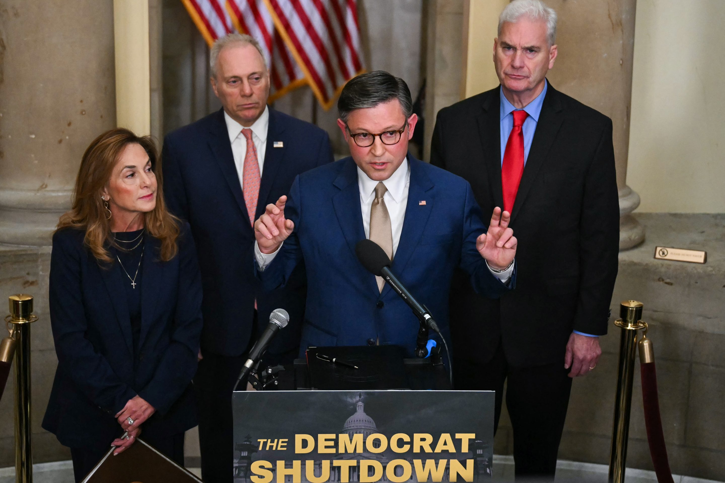 US Speaker of the House Mike Johnson, Republican from Louisiana, speaks during a news conference outside of his office at the US Capitol on the second day of the US government shutdown in Washington, DC, on October 2, 2025, alongside, L/R, Representative Lisa McClain, Republican from Michigan, House Majority Leader Steve Scalise, Republican from Louisiana, and House Majority Whip Tom Emmer, Republican from Minnesota.
