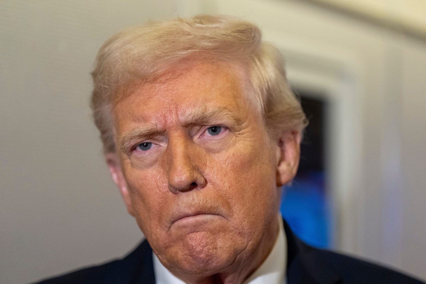 A close-up of Donald Trump scowling