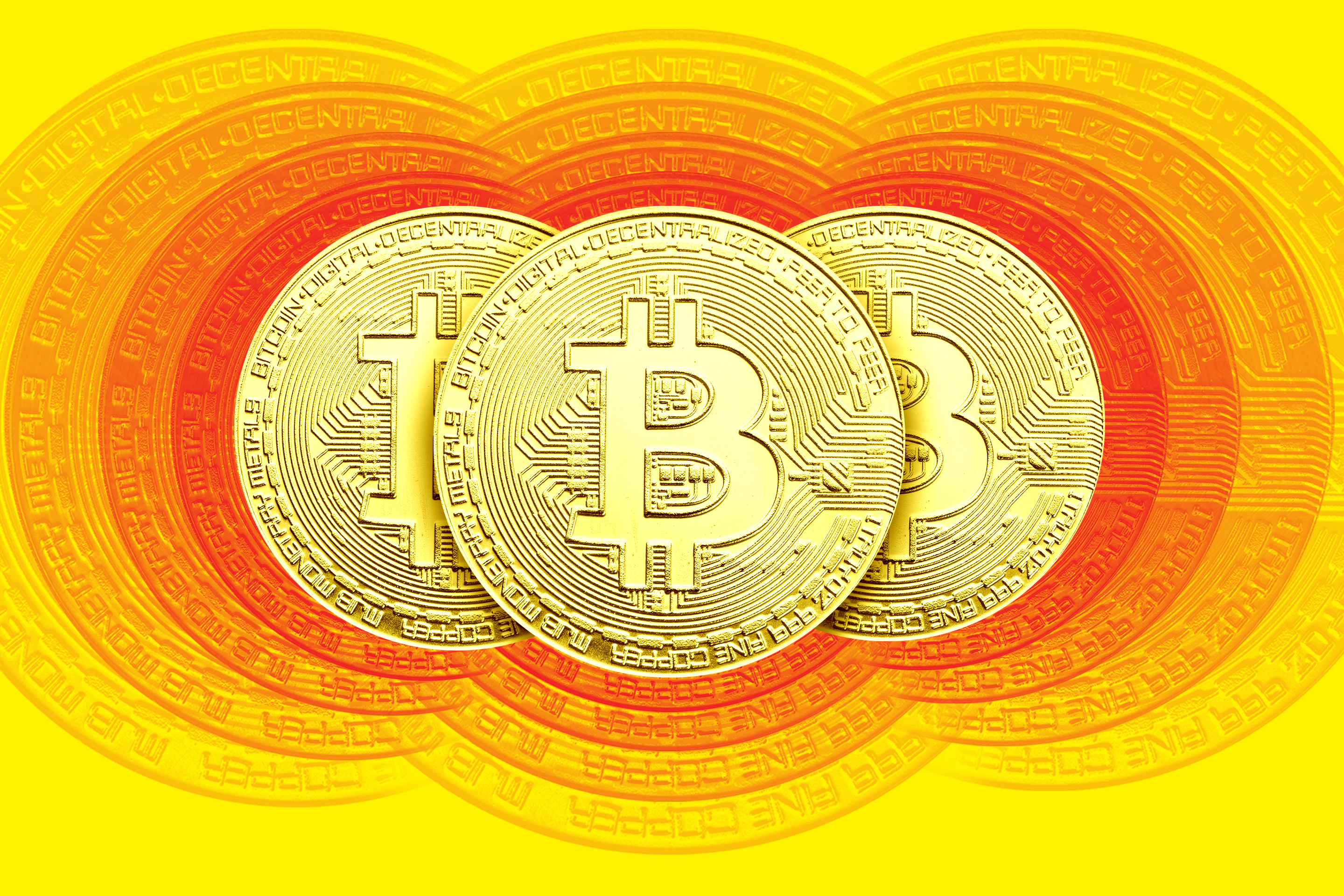 Three Bitcoins disappearing into view.