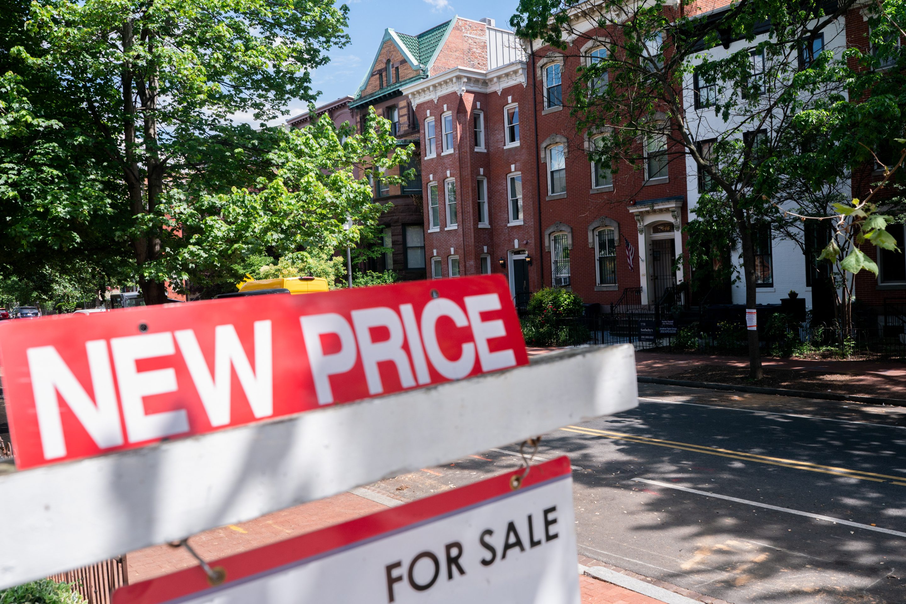 For-sale sign advertising a "new price" in front of a home in Washington, D.C.