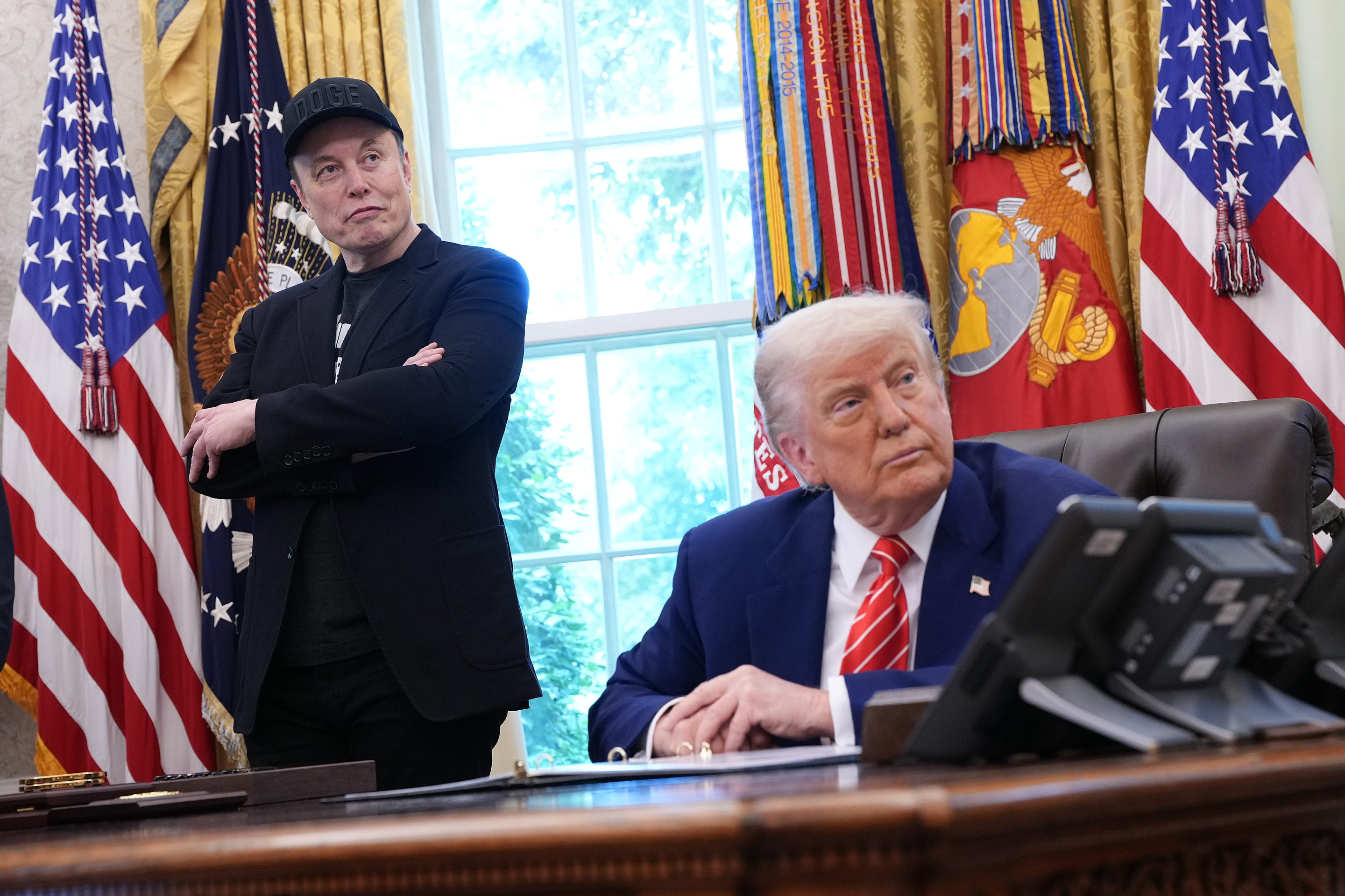 X owner Elon Musk (left) with President Donald Trump in May.