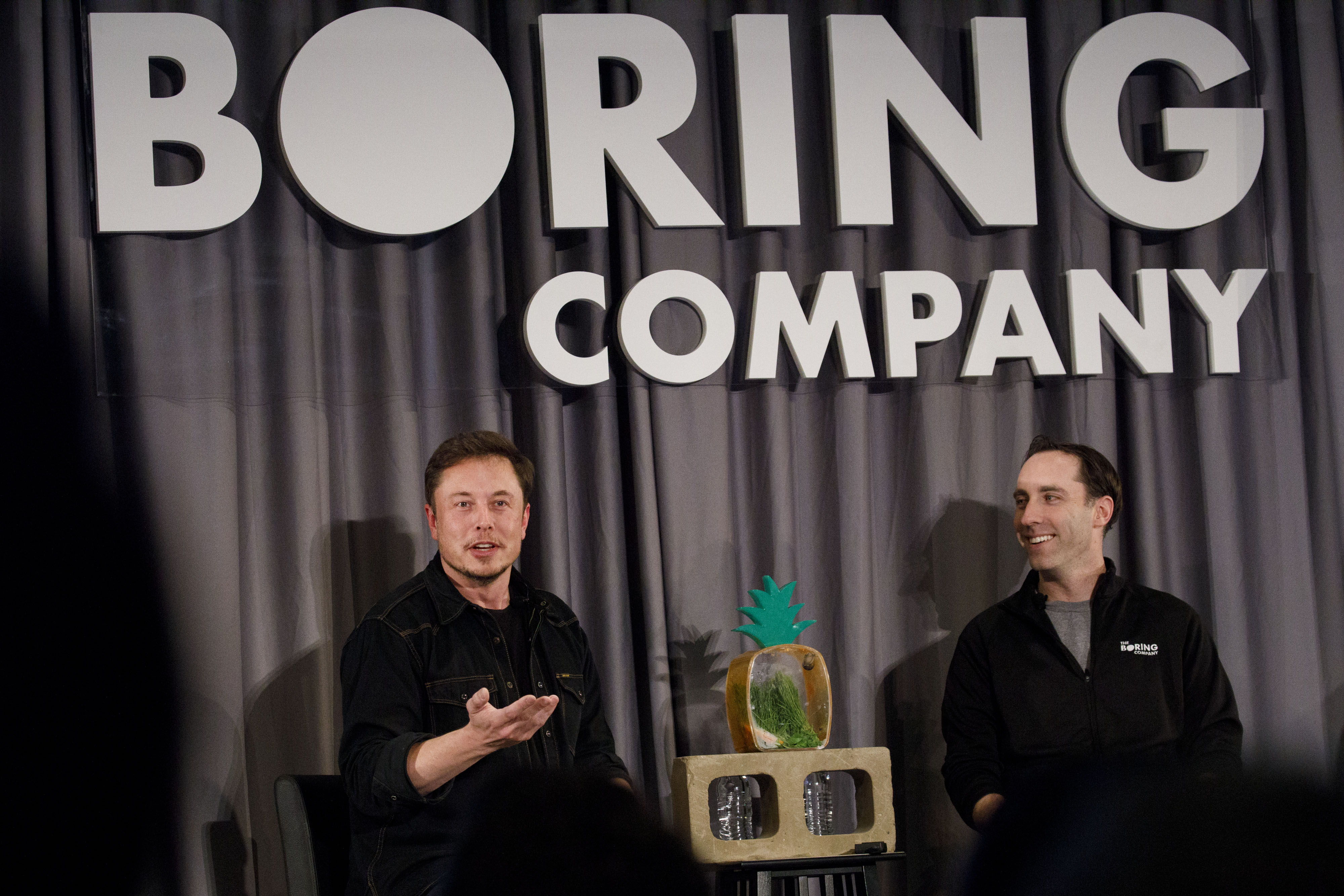 Elon Musk (left) and Steve Davis, president of Boring Company, at a event in 2018 in Los Angeles.