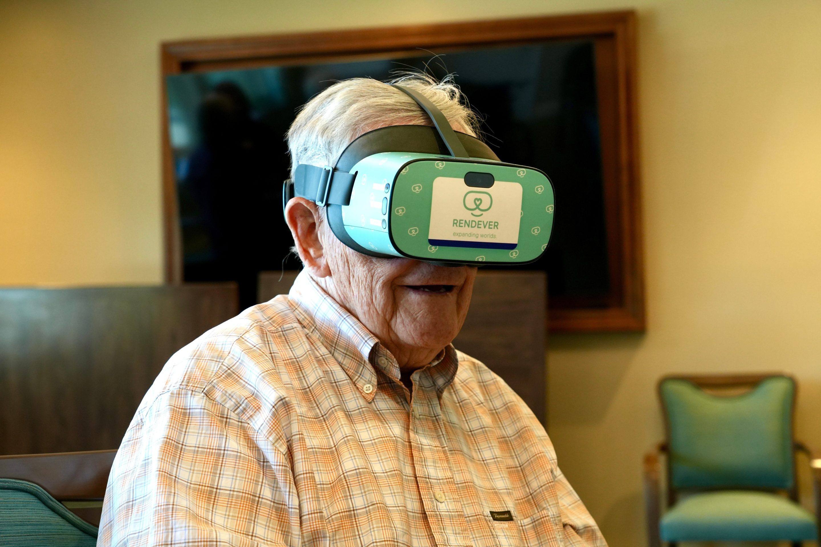 Jim Holtshouse watches video through a Rendever virtual-reality headset at the Forum at Rancho San Antonio retirement community in Cupertino, Calif. on June 11, 2025.