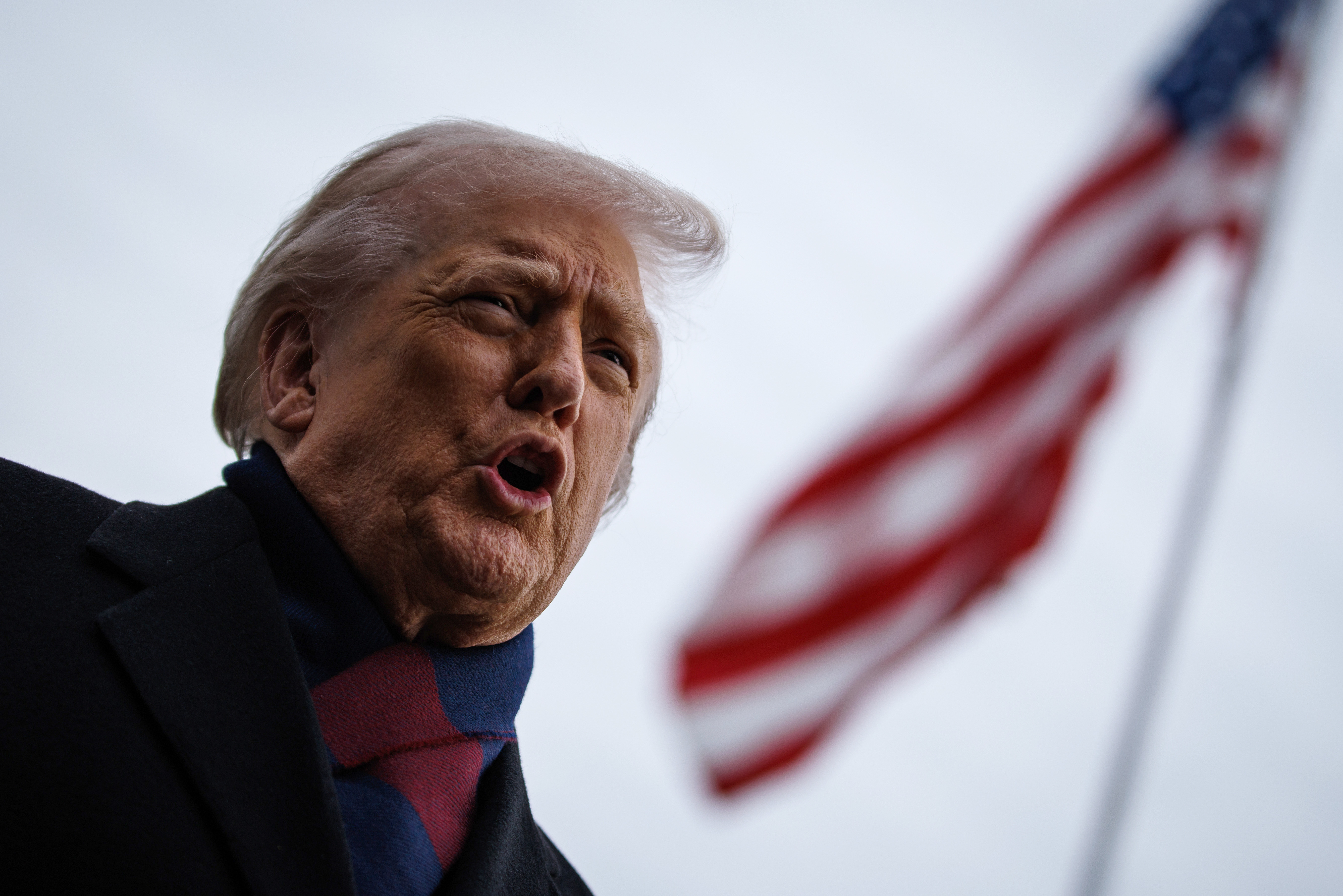 US President Donald Trump speaks to members of the media on the South Lawn of the White House before boarding Marine One in Washington, DC, US, on Saturday, Dec. 13, 2025.