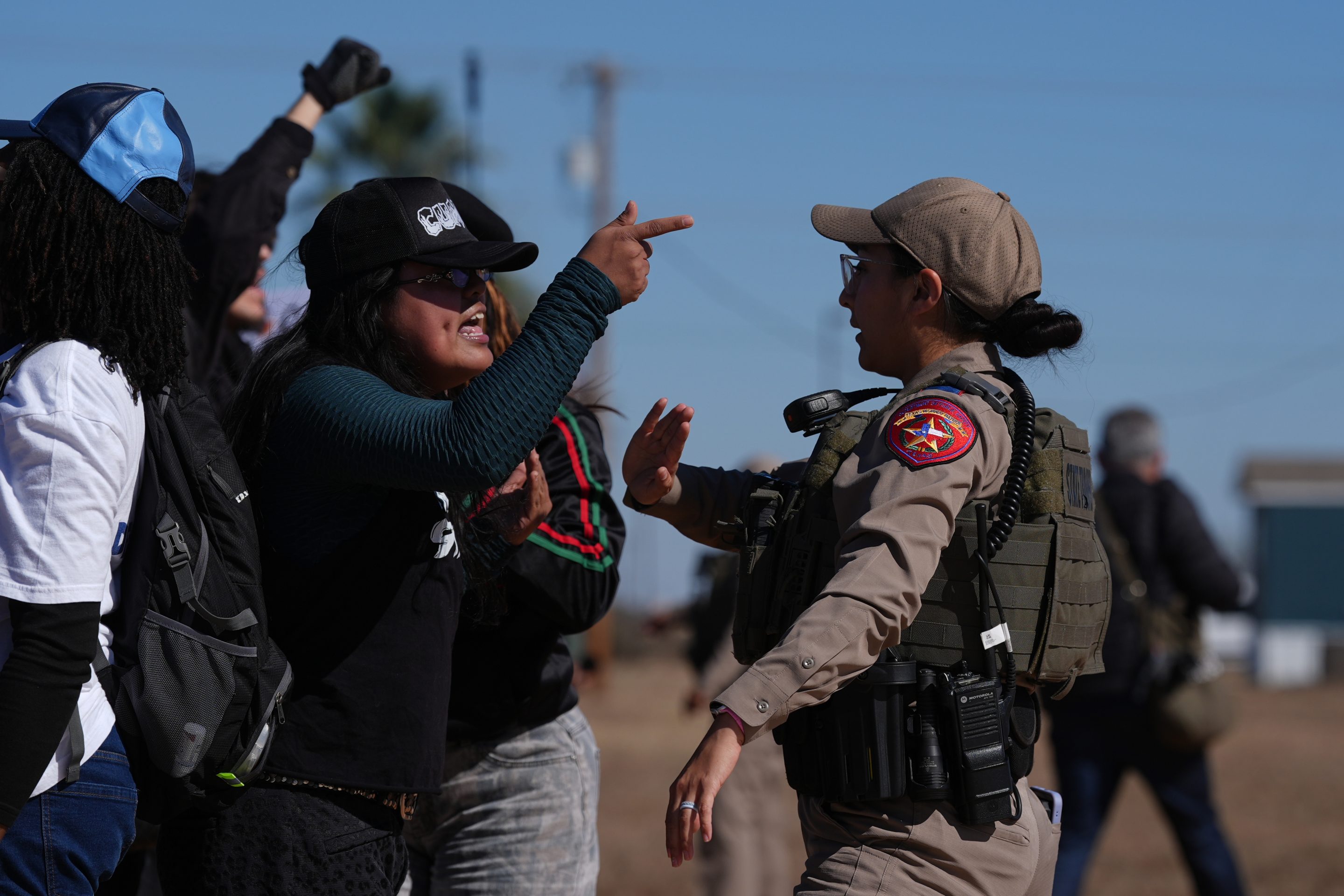 Protesters yell at a Texas state trooper outside the South Texas Family Residential Center detention facility where Liam Ramos and his father are being detained in Dilley, Texas, Wednesday, Jan. 28, 2026.