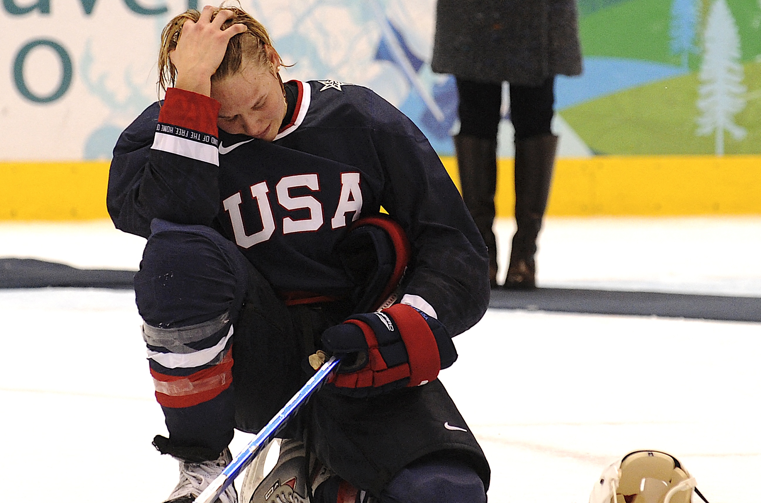 Photo: A member of the USA team cries during the medals ceremony following their loss against Canada to win the Silver in the Women's Gold Medal Hockey game at the Canada Hockey Place during the XXI Winter Olympic Games in Vancouver, Canada on February 25, 2010. Canada won 2-0 to win the gold.