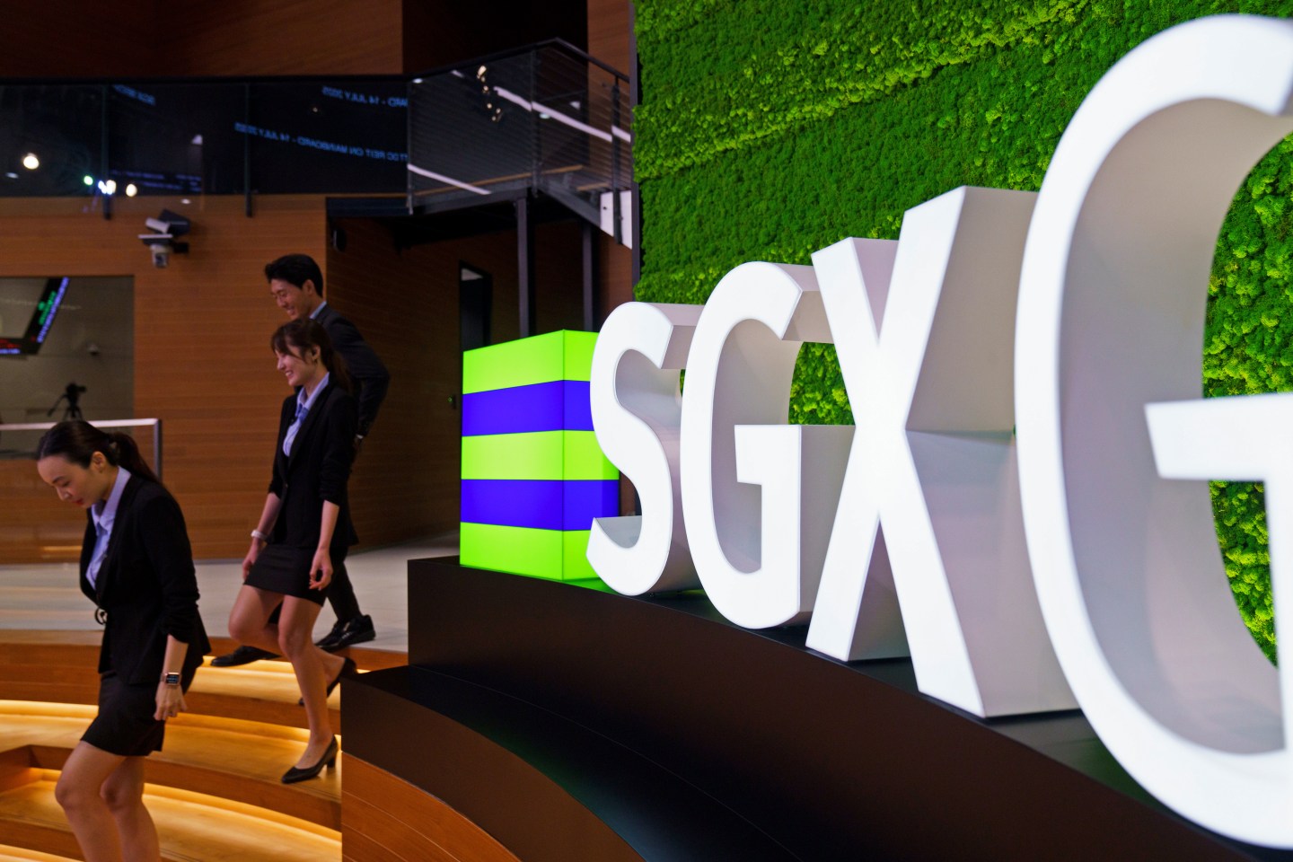 Singapore tries to give its flagging stock market a kickstart with a link to the NASDAQ, allowing firms to easily list in both places