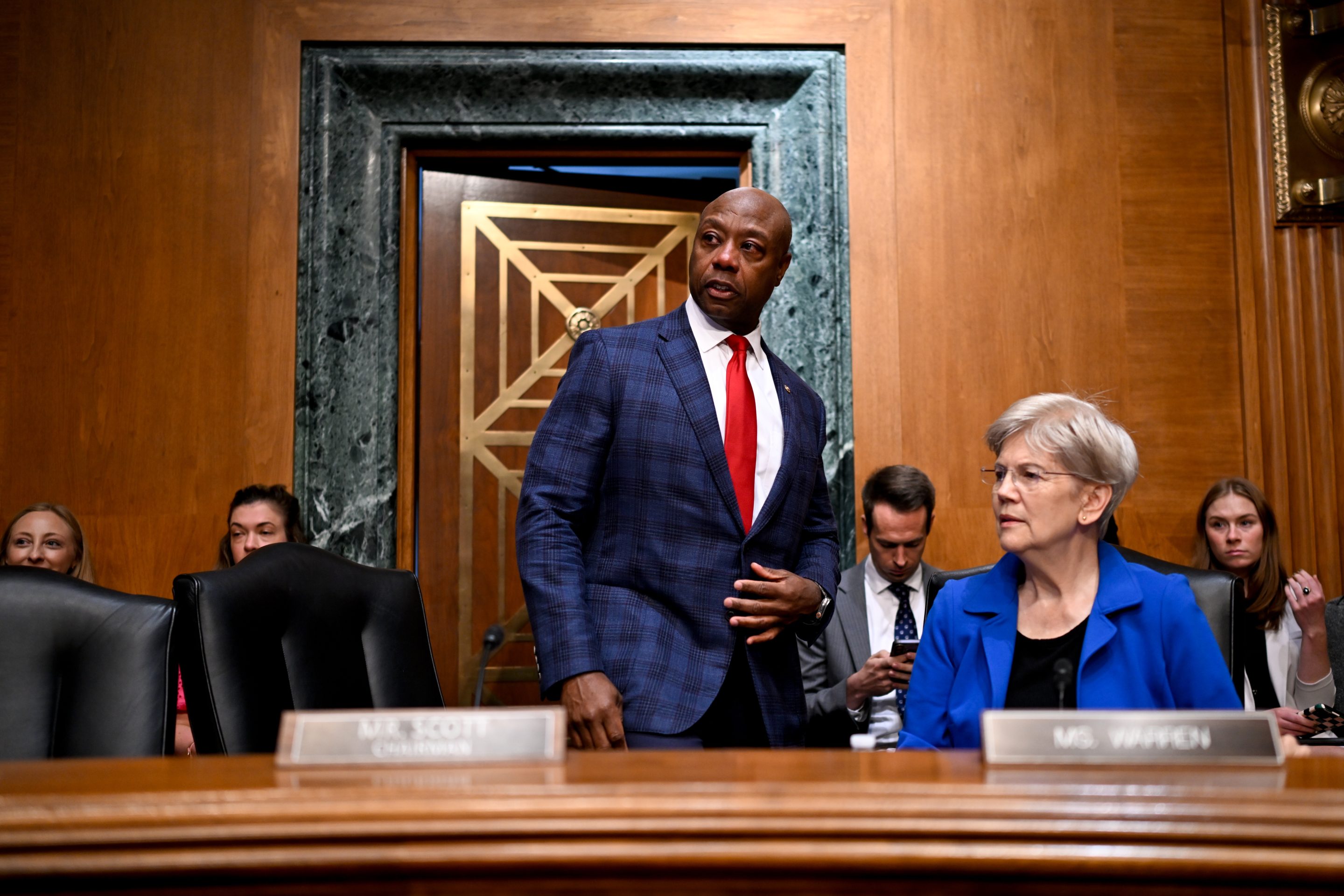 Senator Tim Scott, a Republican from South Carolina and chairman of Senate Banking, Housing, and Urban Affairs Committee, center, and Senator Elizabeth Warren, a Democrat from Massachusetts and ranking member of Senate Banking, Housing, and Urban Affairs Committee