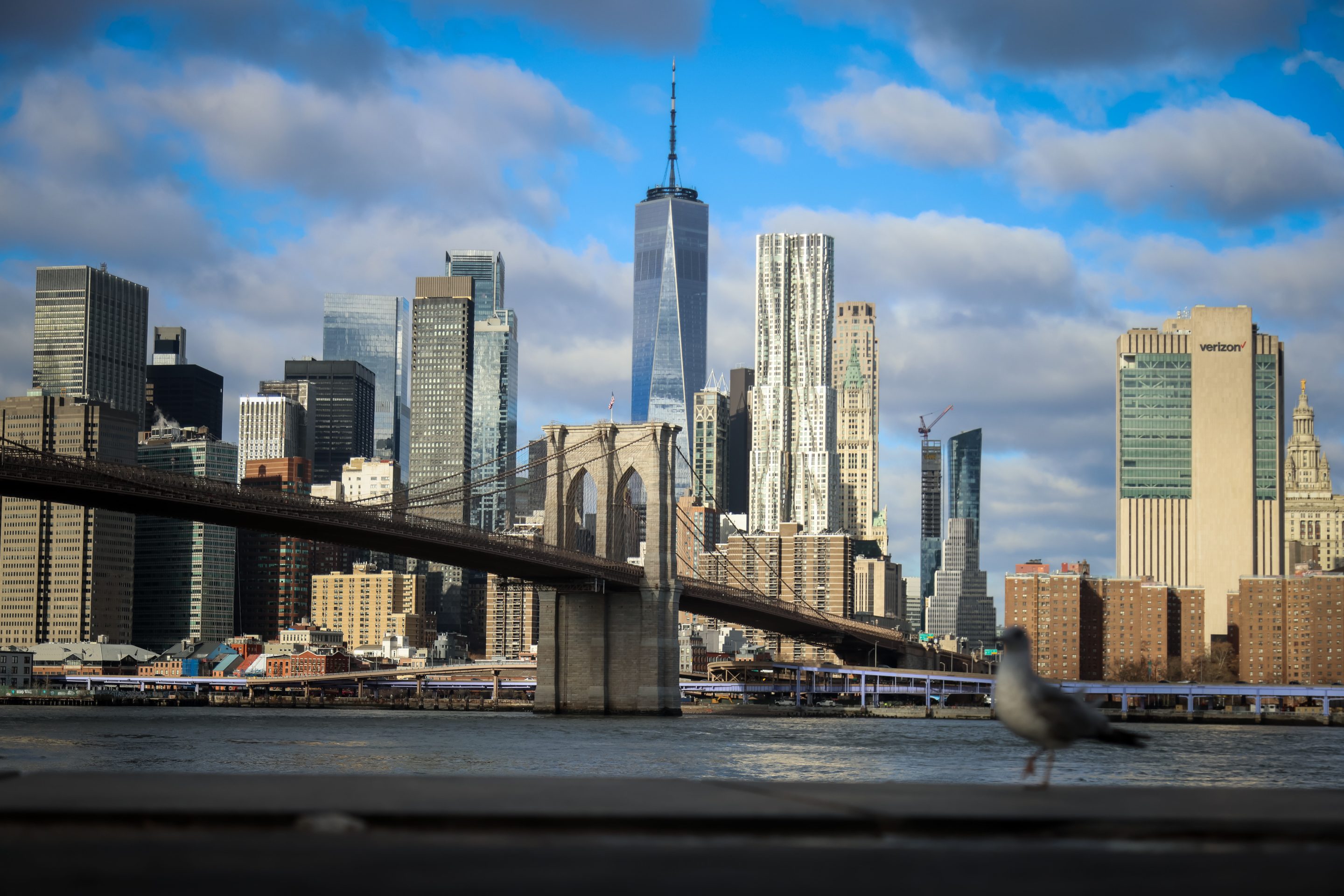 The Brooklyn Bridge and One World Trade Center along the Manhattan skyline in New York, US, on Tuesday, Dec. 30, 2025.