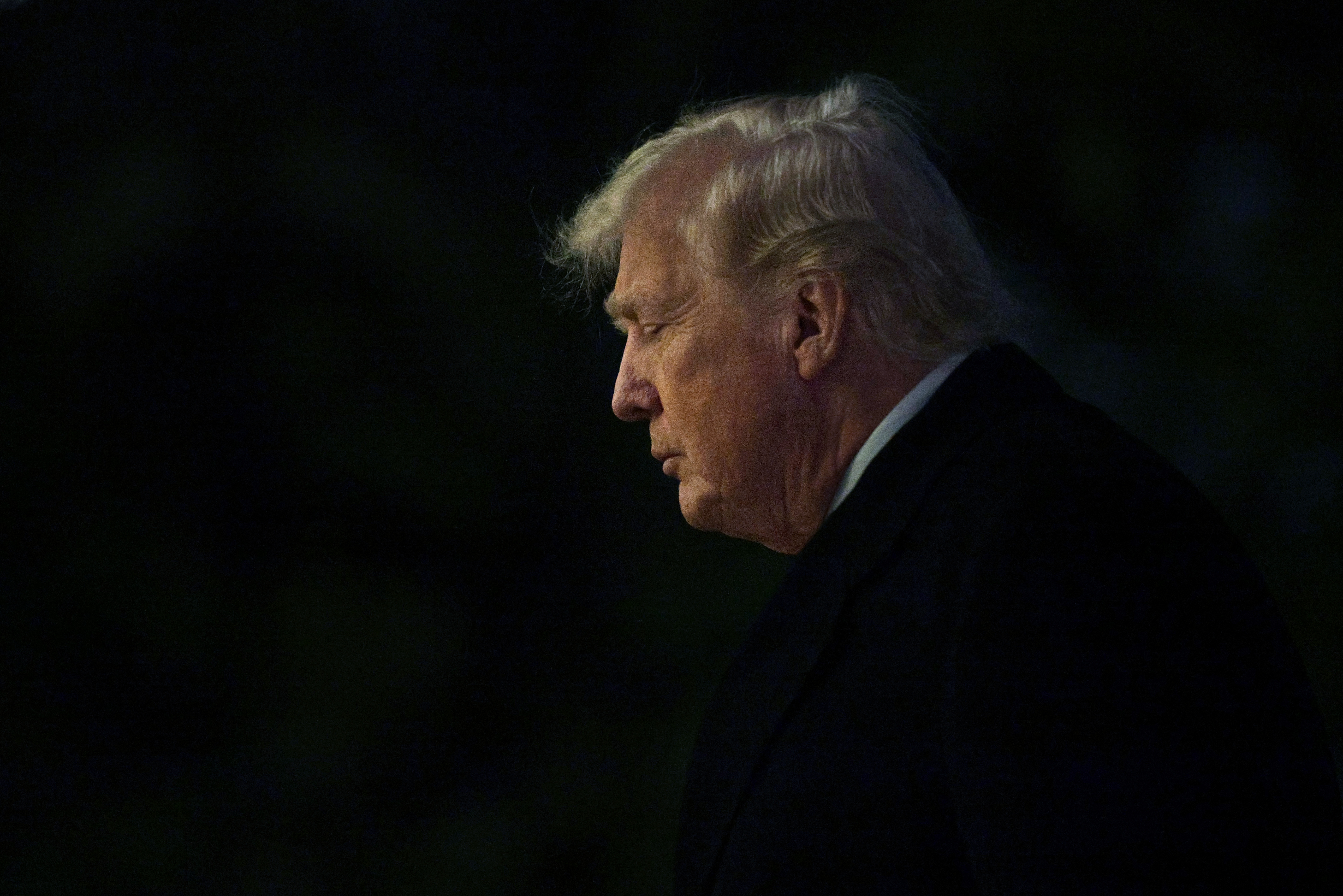 U.S. President Donald Trump walks on the South Lawn after landing at the White House on January 4, 2026, in Washington, D.C.