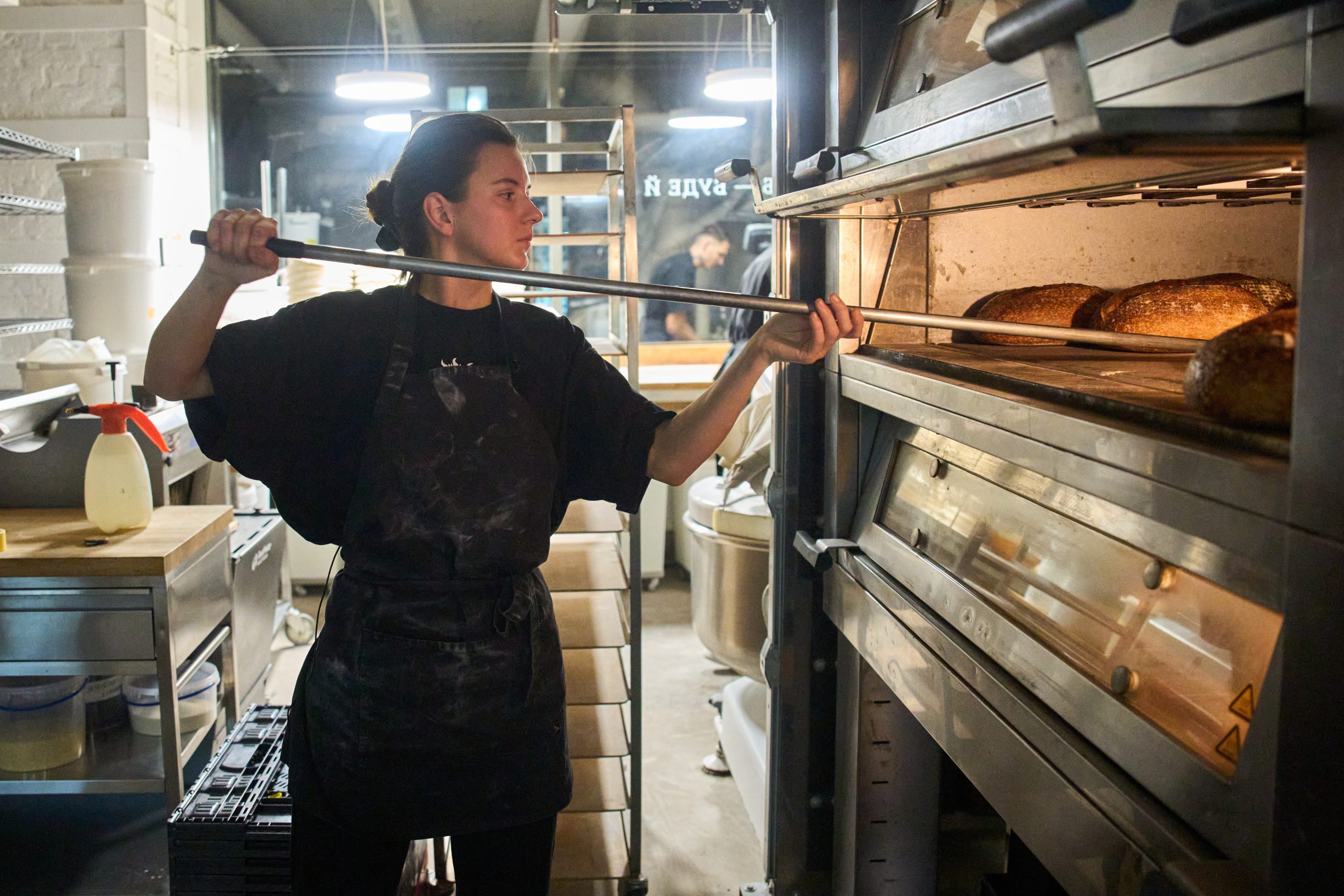 Olha Hrynchuk, 28, owner of a bakery, bakes bread early morning running on a generator during a blackout caused by Russia's regular air attacks on the country's energy system Friday, Jan. 30, 2026 in Kyiv.