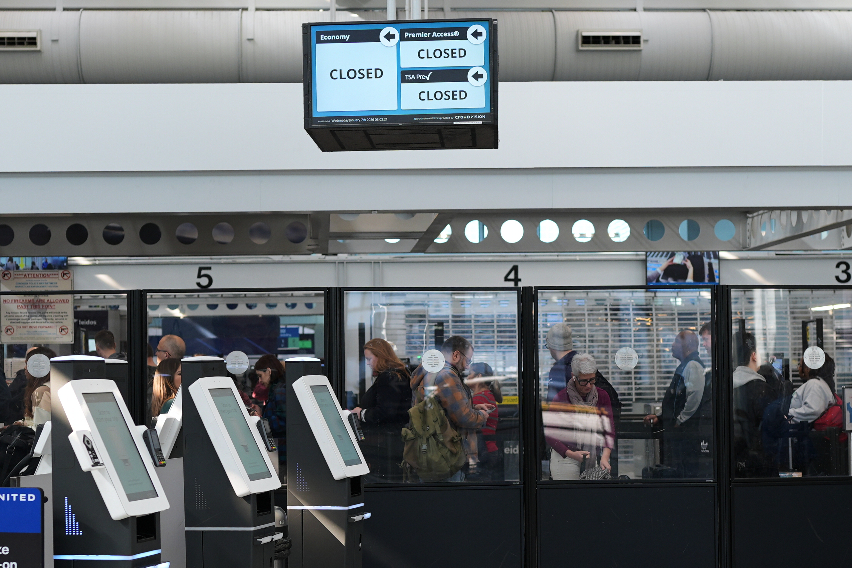 An information screen is displayed in Terminal 1 at O'Hare International Airport, in Chicago, Sunday, Feb. 15, 2026.