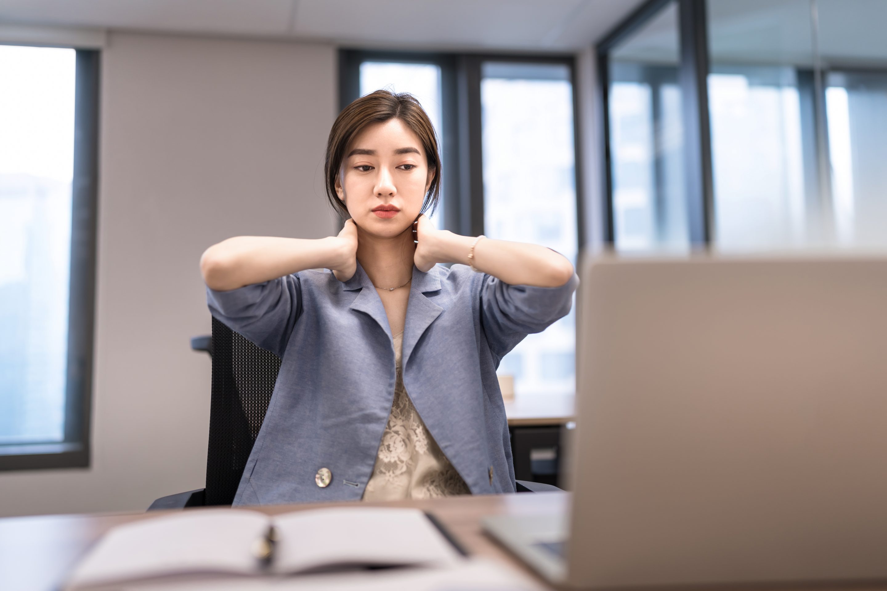 Stressed and sad worker in office