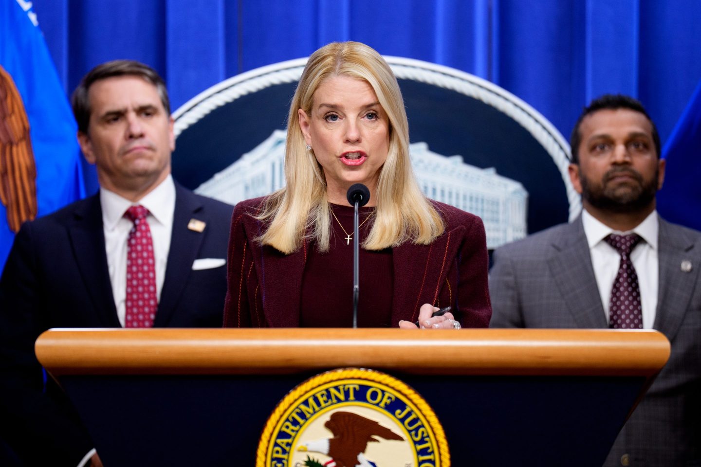 Pam Bondi speaks at a podium.