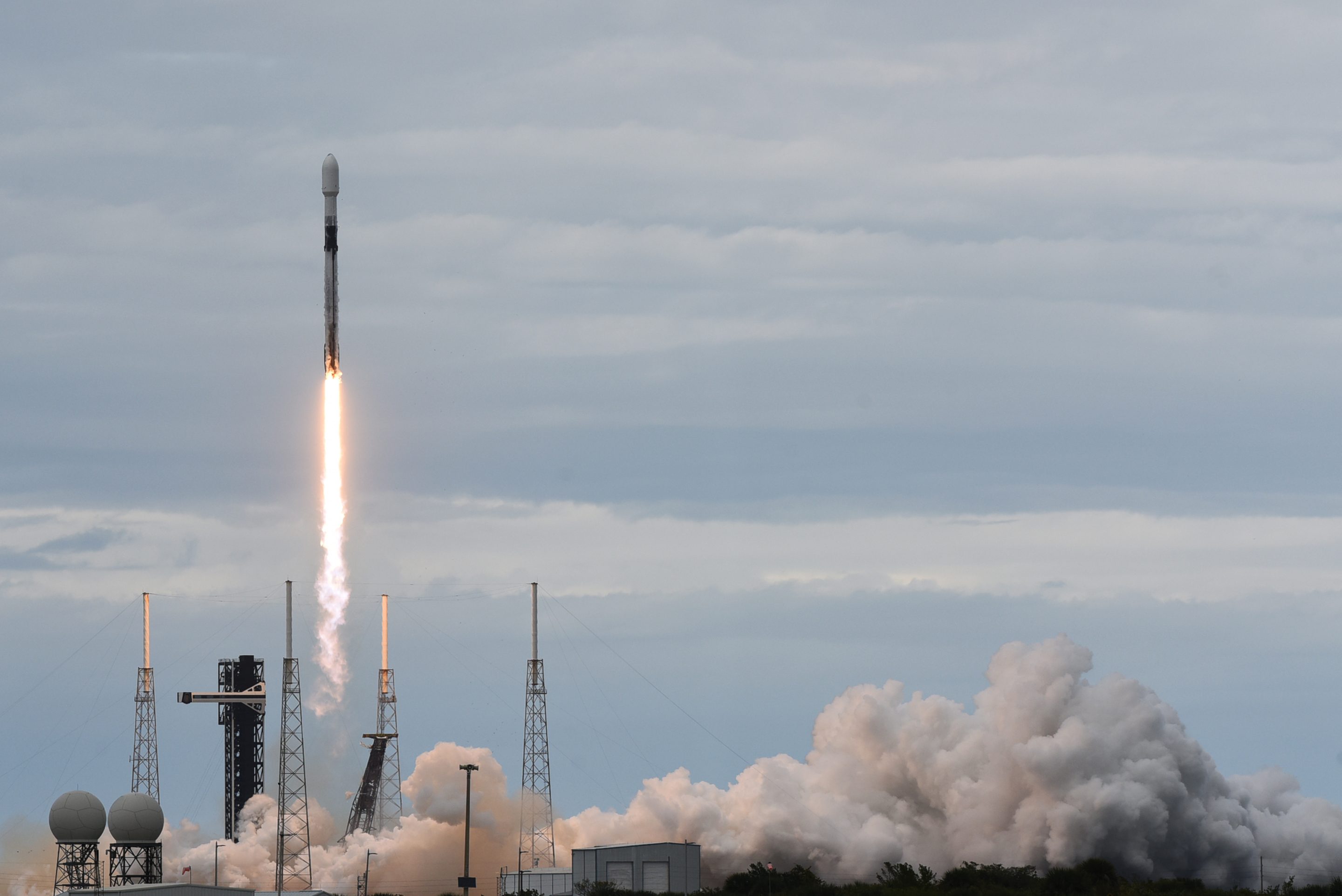 A SpaceX Falcon 9 rocket carrying a classified payload for the National Reconnaissance Office (NRO) launches from pad 40 at Cape Canaveral Space Force Station on December 9, 2025.