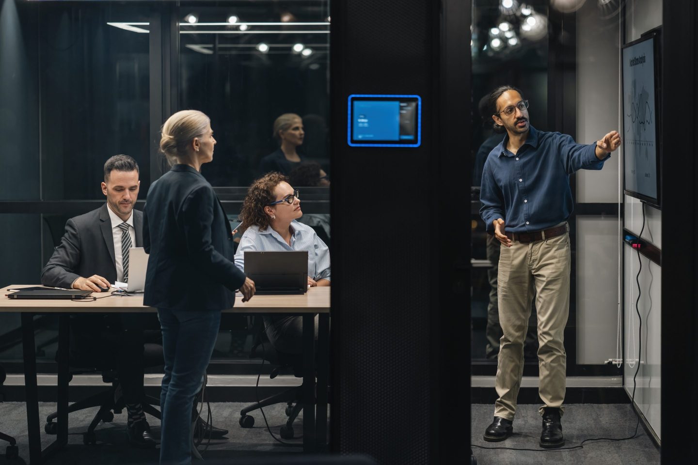 Photo of several people working on a presentation together