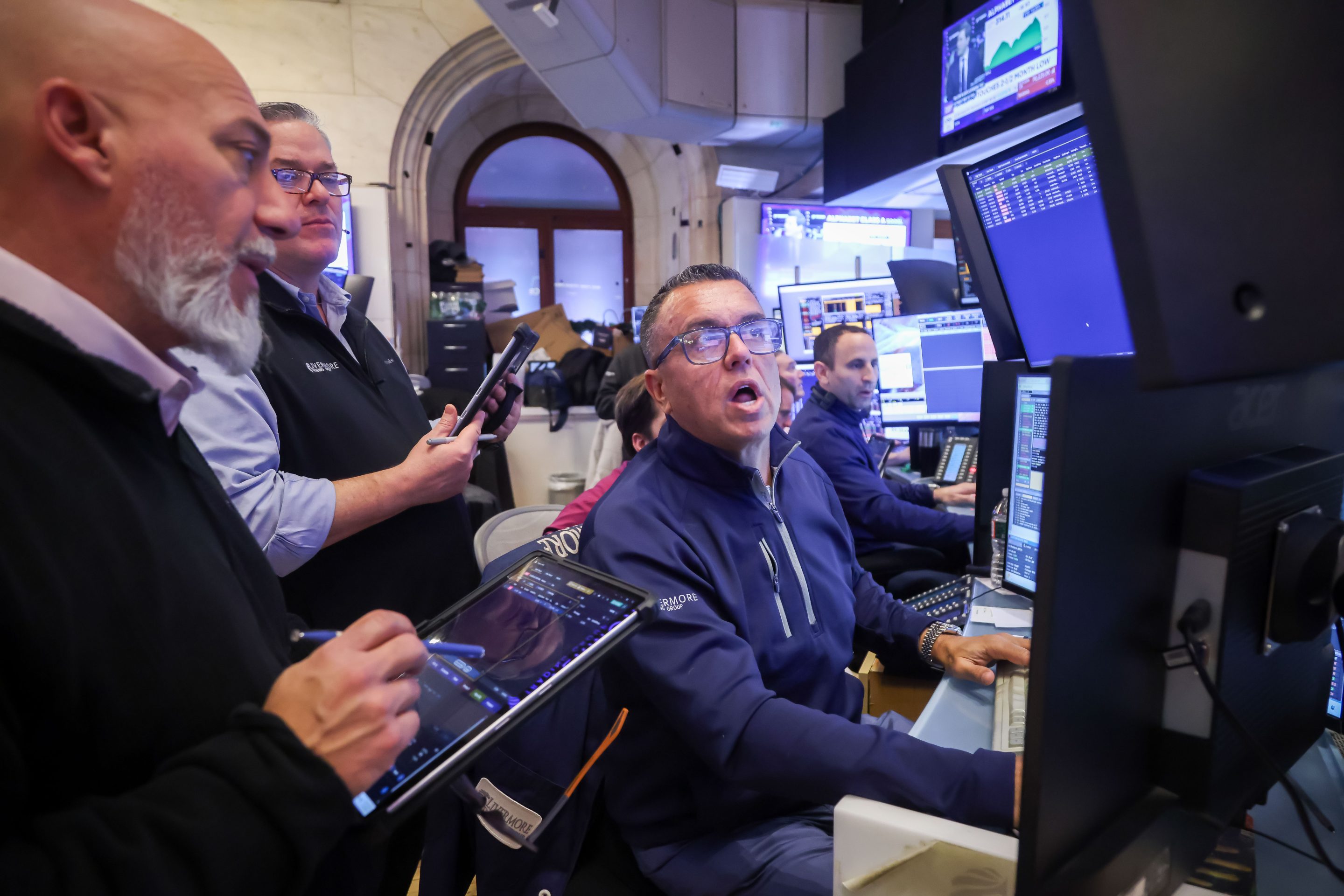 Traders work on the floor of the New York Stock Exchange on Thursday, Feb. 5, 2026.