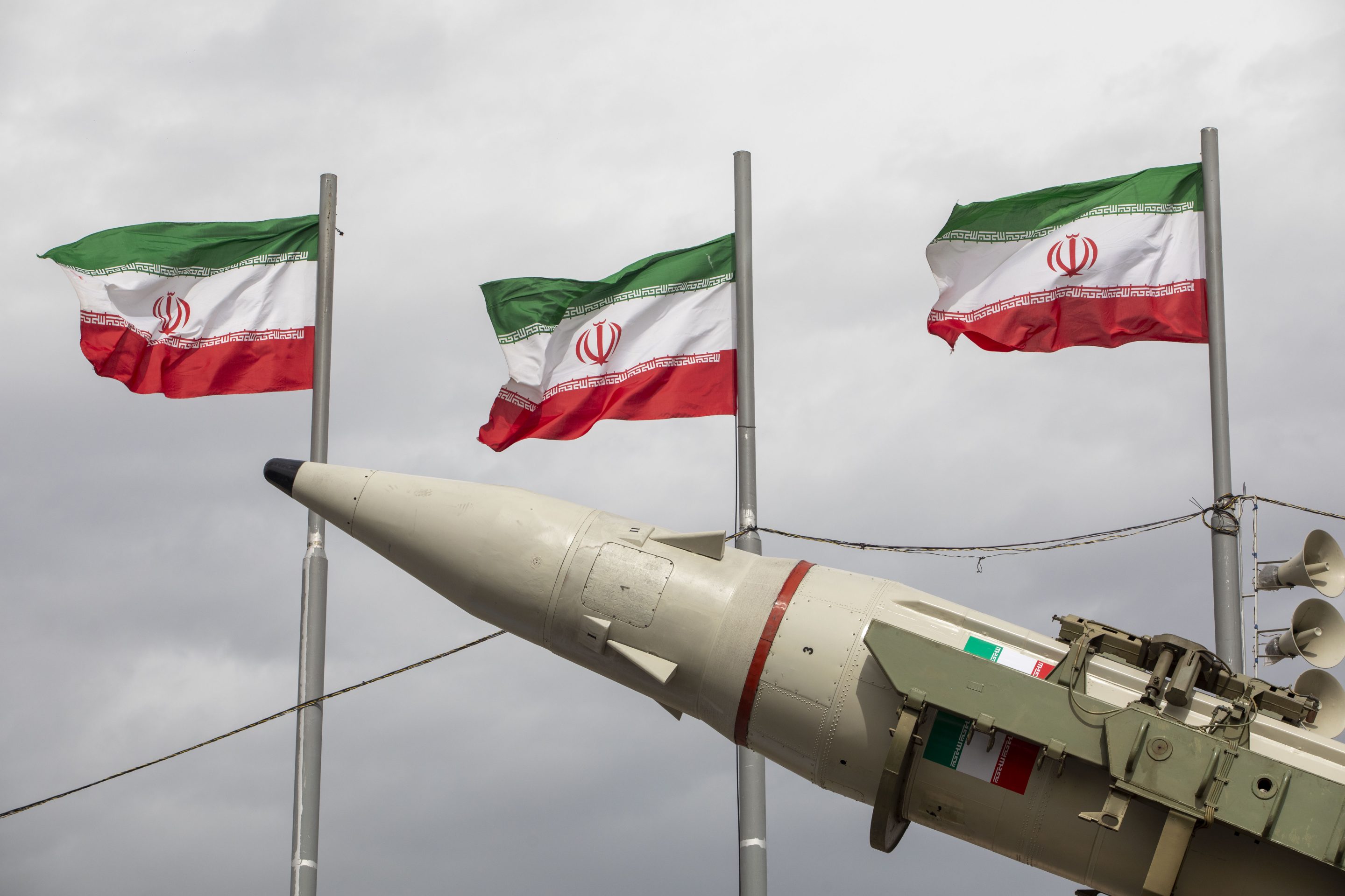 Missiles produced by Iran's armed forces are displayed near a row of Iranian flags during commemorations to mark the anniversary of the 1979 Iranian Revolution on February 11, 2026 in Tehran.