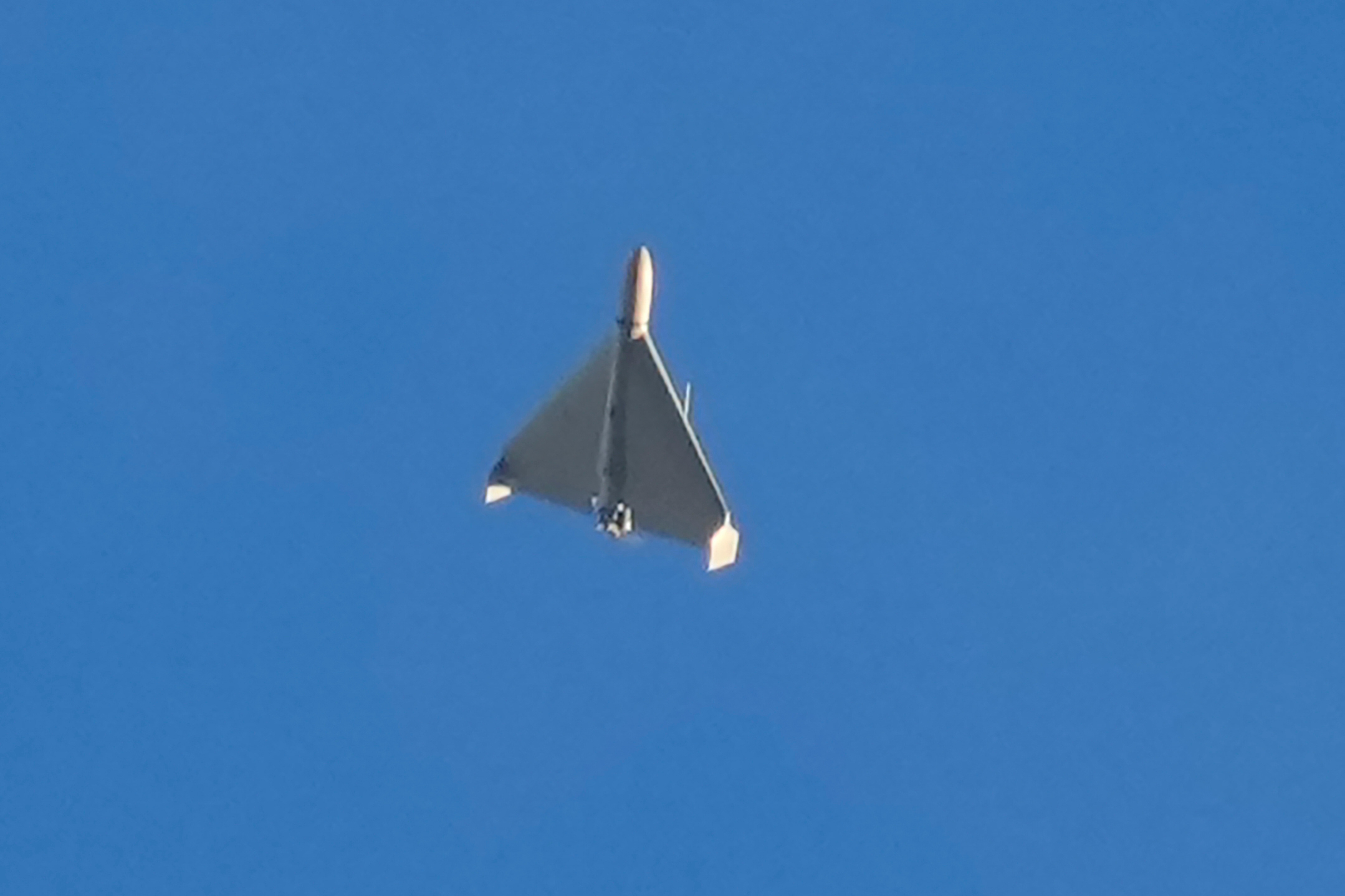 An Iranian Shahed exploding drone launched by Russia flies through the sky seconds before it struck buildings in Kyiv, Ukraine, on Oct. 17, 2022. 