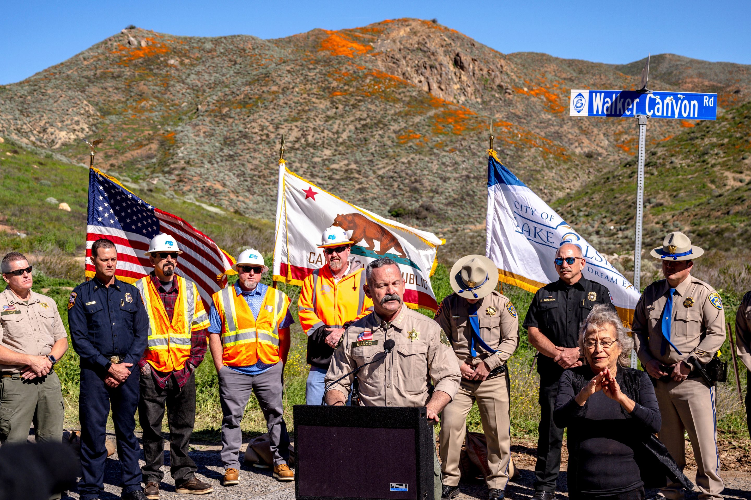 Riverside County Sheriff Chad Bianco speaks at a news conference in Lake Elsinore, Calif., Feb. 7, 2023, as officials announced that the closure of poppy fields at Walker Canyon until the wildflower bloom subsides.
