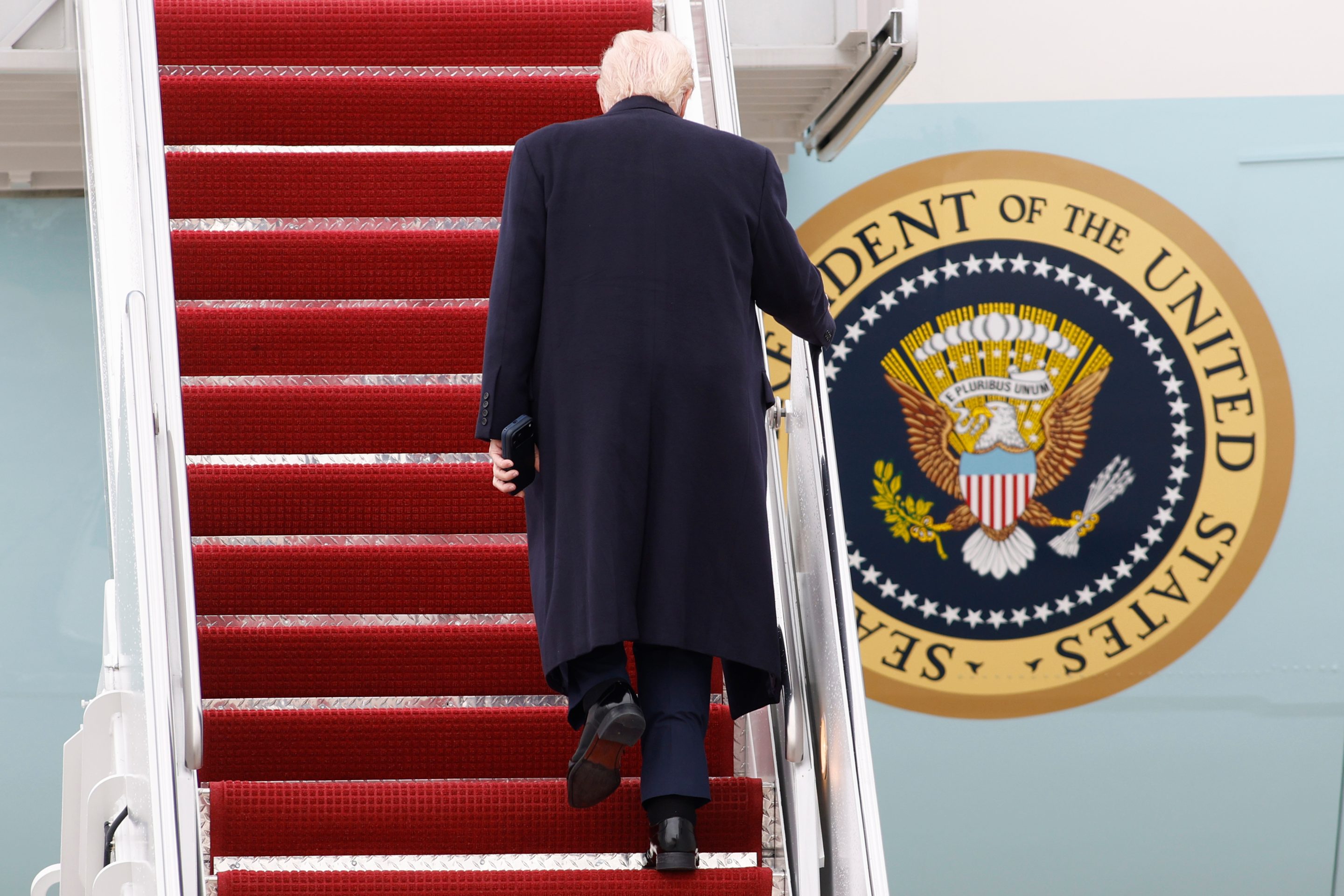 President Donald Trump walks up the stairs of Air Force One at Joint Base Andrews, Md., Friday, March 27, 2026.
