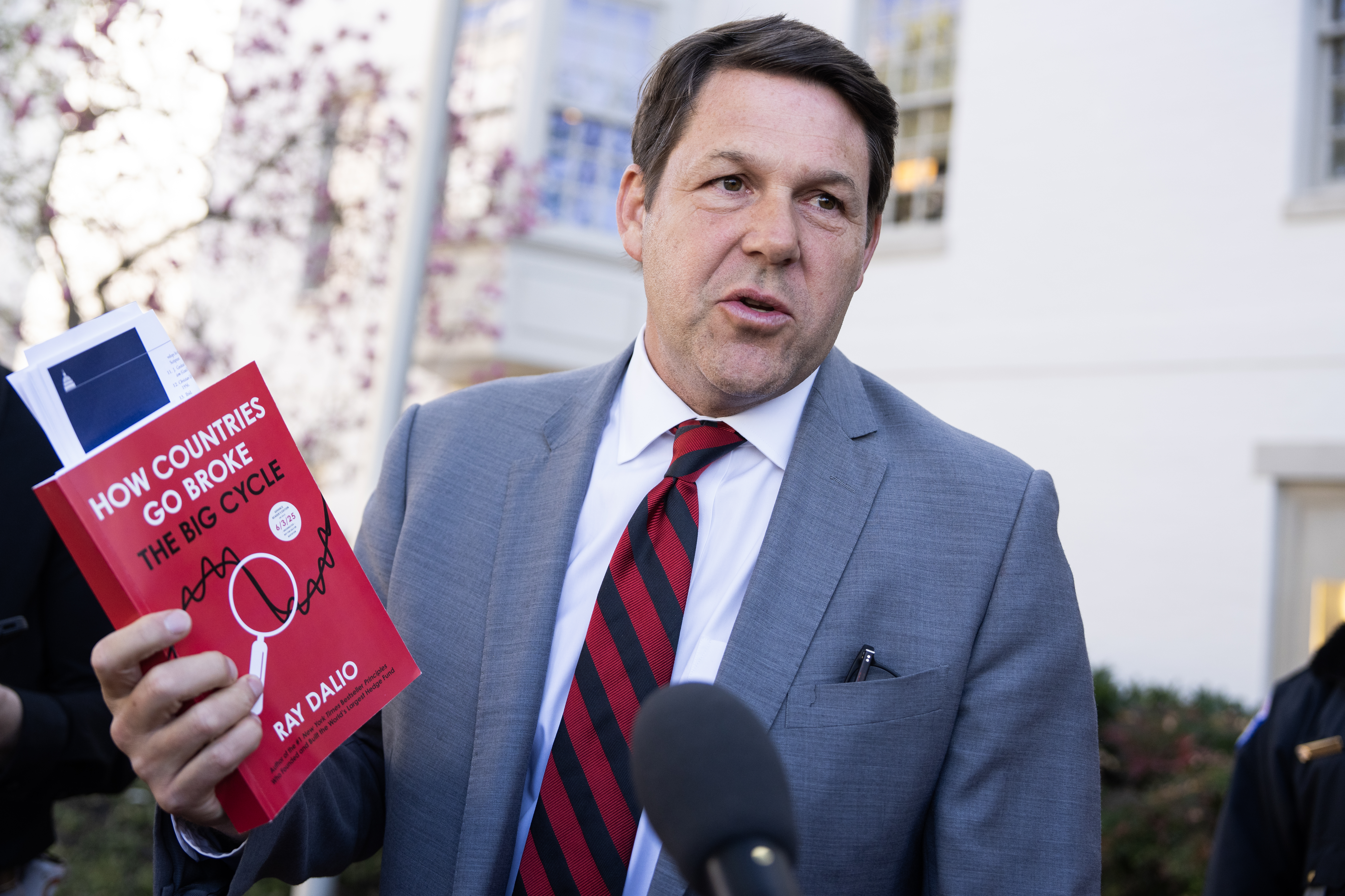 Rep. Jodey Arrington holds a copy of the Ray Dalio book “How Countries Go Broke.” Arrington points out, “It took roughly 200 years to accumulate the first $1 trillion. Now we add that in a matter of months.”