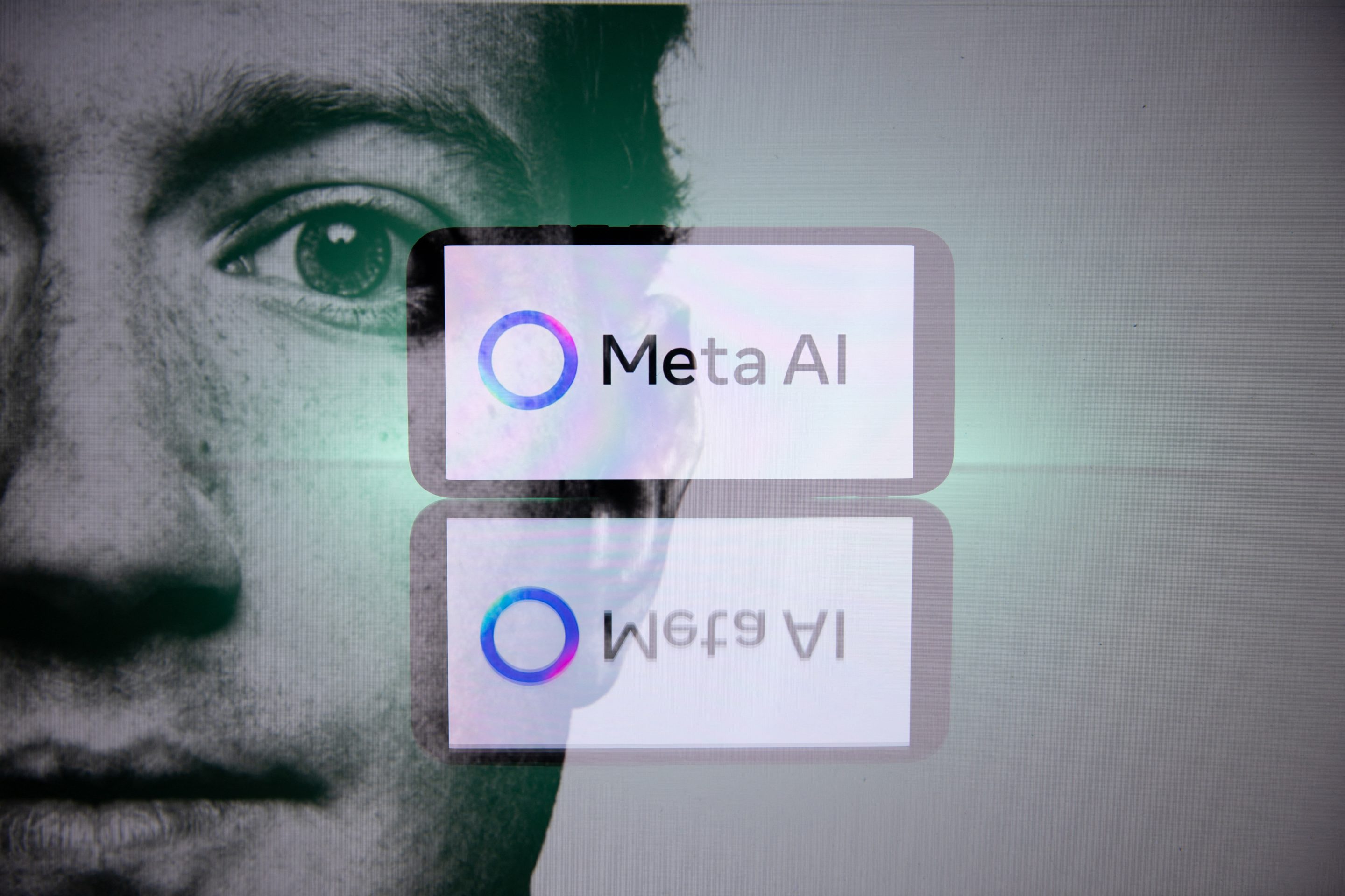 Double exposure photograph of a portrait of Mark Zuckerberg and a telephone displaying the Meta group s artificial intelligence logo at Kerlouan in Brittany in France on April 11 2025. (Photo by Vincent Feuray / Hans Lucas / Hans Lucas via AFP) (Photo by VINCENT FEURAY/Hans Lucas/AFP via Getty Images)