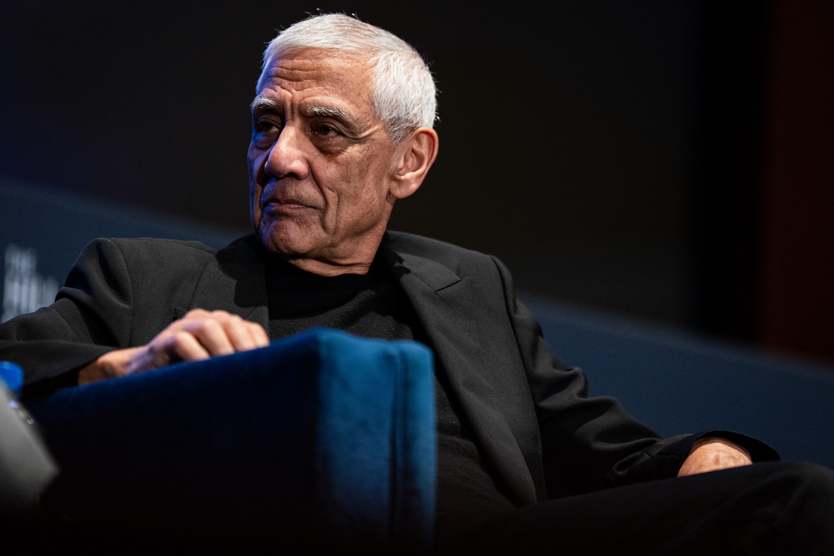Vinod Khosla sits on a blue chair