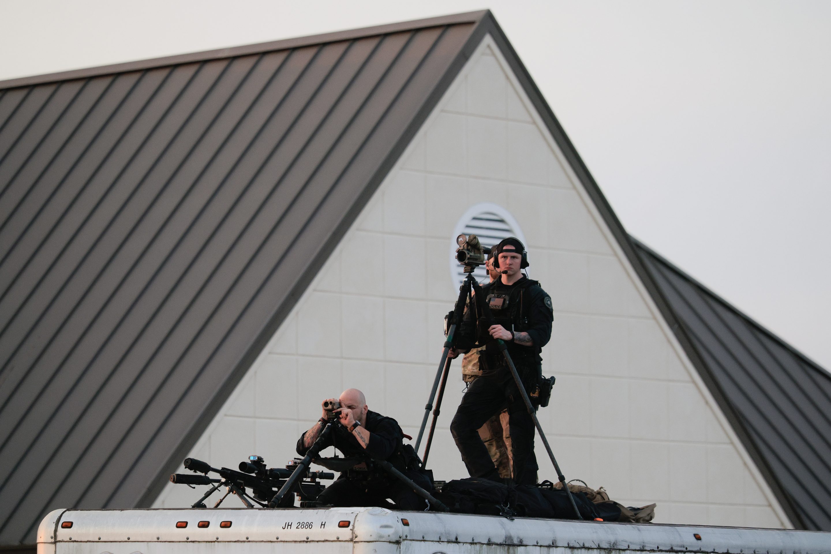 U.S. Secret Service Counter Sniper Team members watch over Richard B. Russell Regional Airport as President Donald Trump departs on February 19, 2026 in Rome, Georgia.