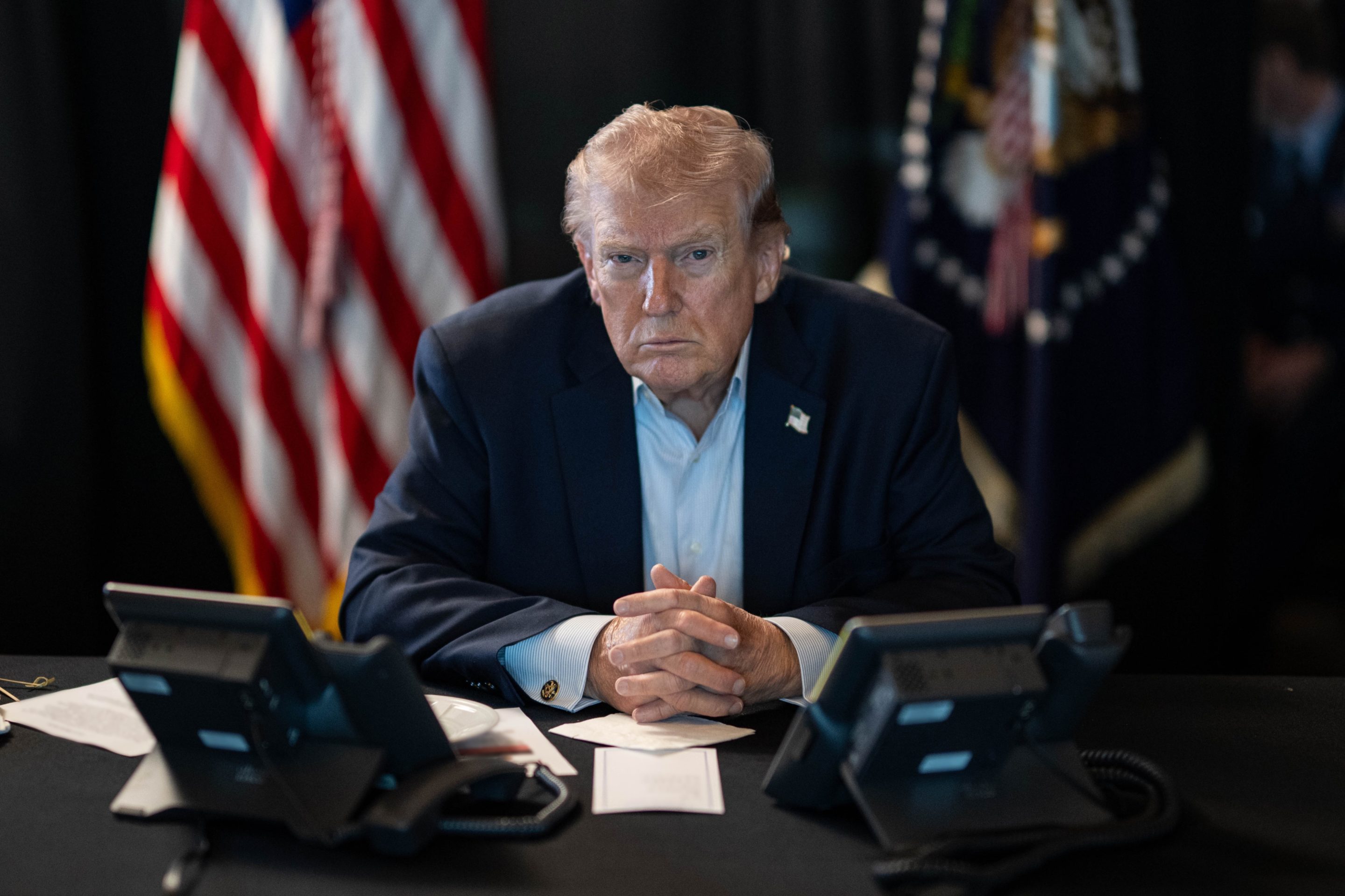 U.S. President Donald J. Trump sits at a table monitoring military operations during Operation Epic Fury against Iran, with U.S. flags visible behind him, in Washington, United States, on March 02, 2026.