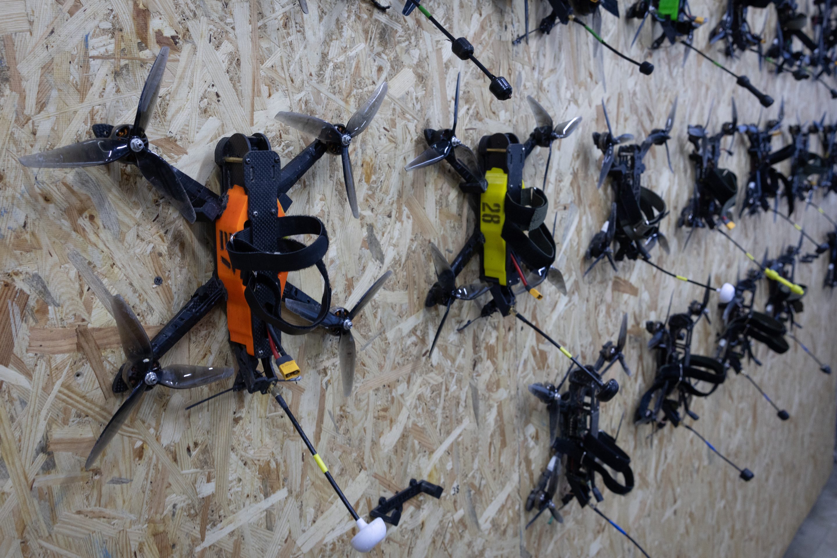 FPV training drones are seen on a wall at the Killhouse Academy drone training center on March 4, 2026 in Kyiv, Ukraine.