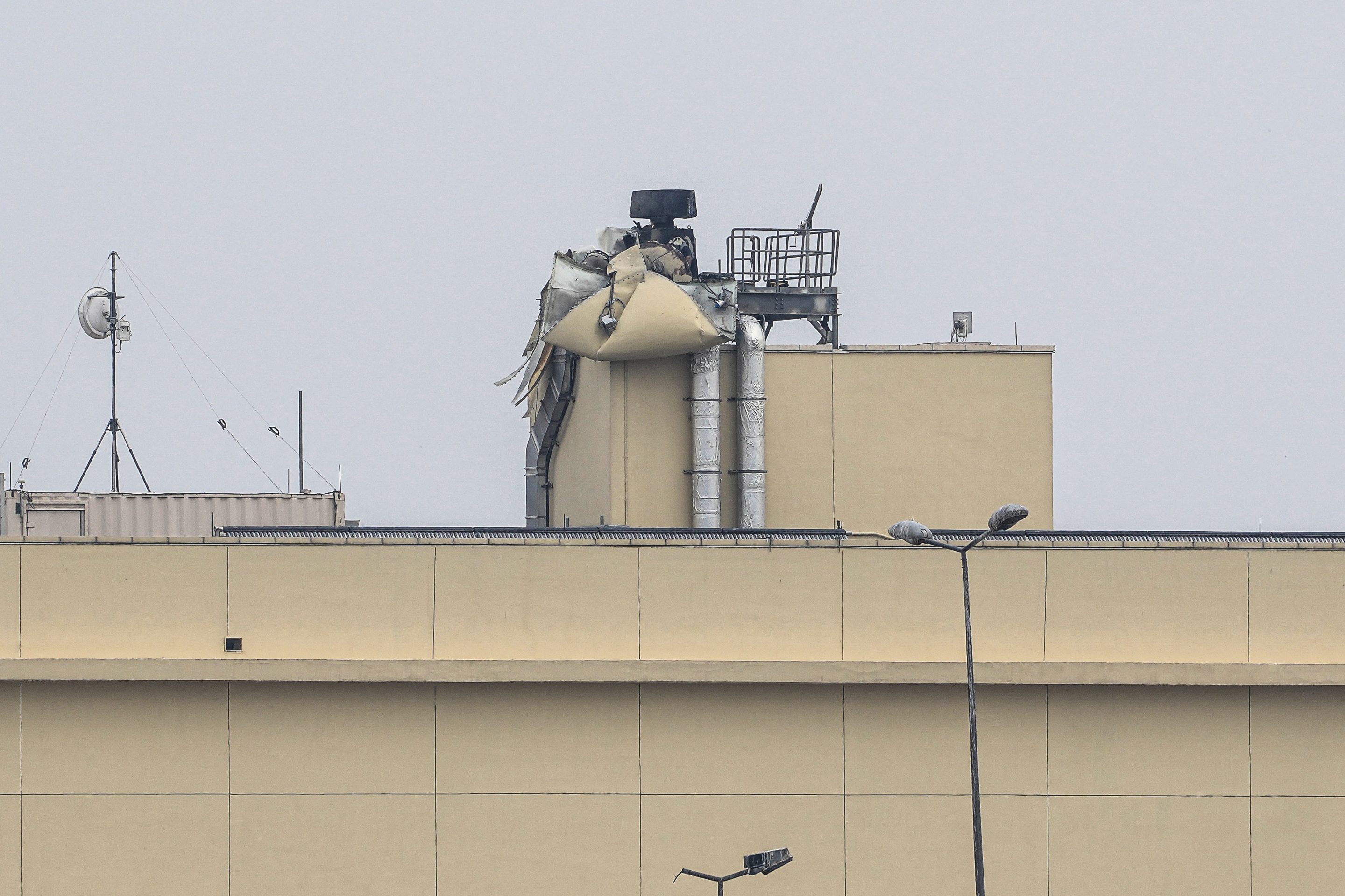 A photograph shows the damage following a reported drone strike on the US embassy in Baghdad's fortified "Green Zone" on March 14, 2026. 