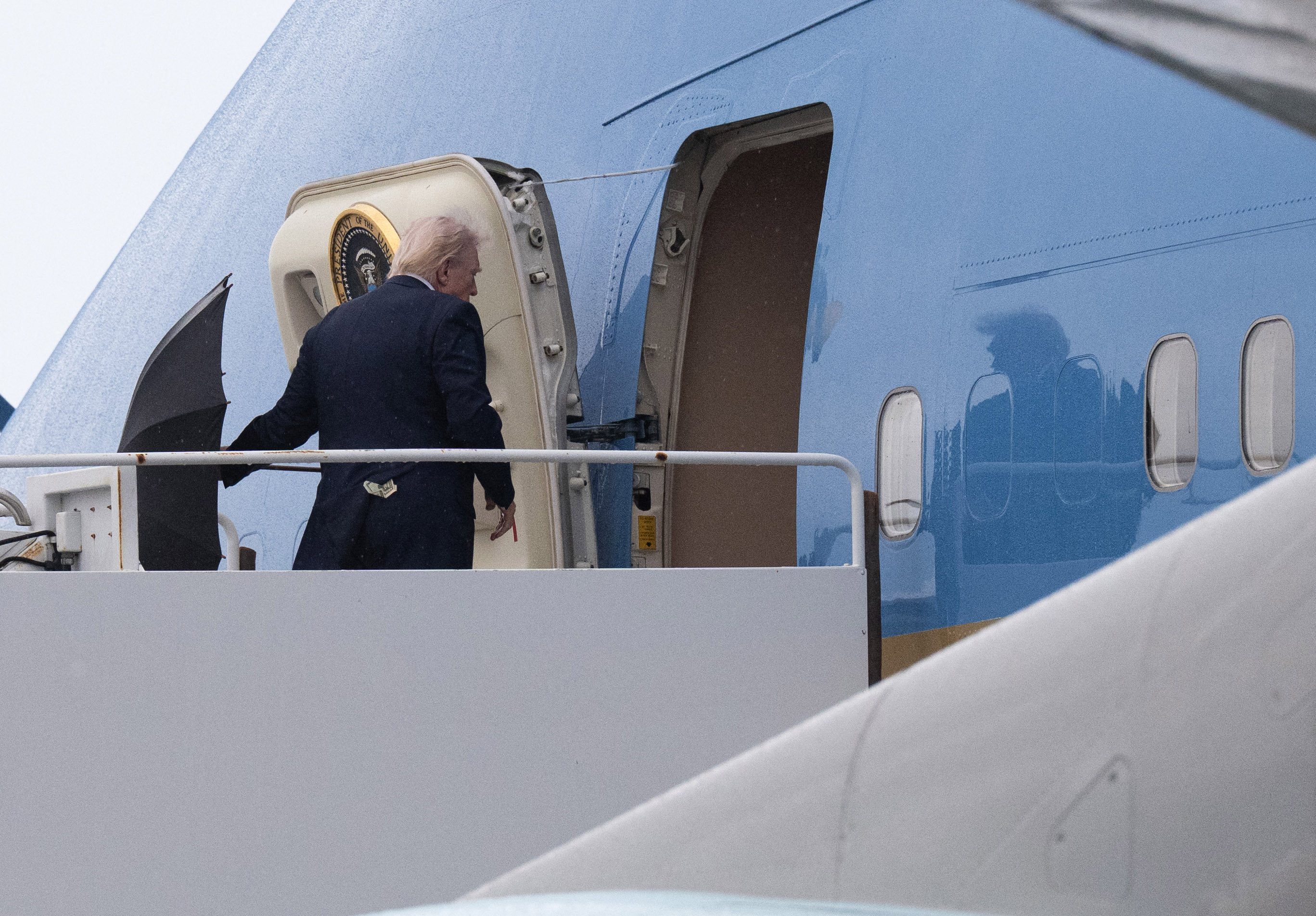 President Donald Trump boards Air Force One at Palm Beach International Airport in West Palm Beach, Florida, on March 15, 2026.