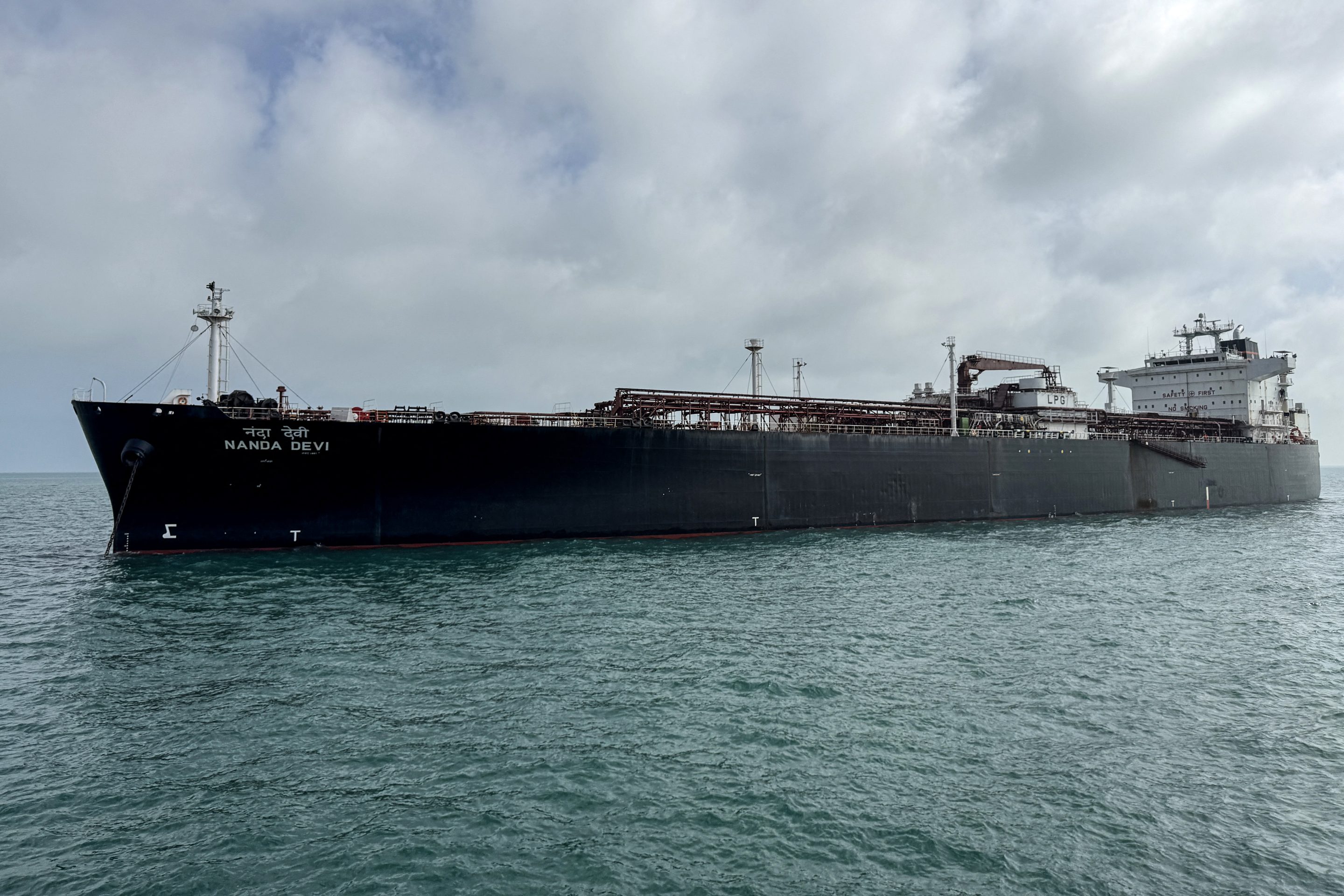 Indian vessel Nanda Devi carrying liquefied petroleum gas arrives at Vadinar Port in the Jamnagar district of Gujarat state on March 17, 2026 after Iran allowed it to pass through the Strait of Hormuz.