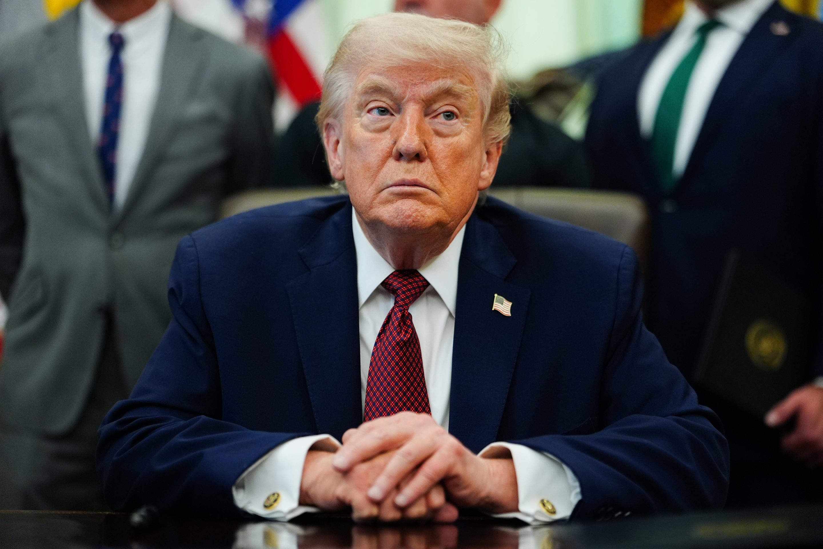 President Donald Trump listens in the Oval Office of the White House, Saturday, April 18, 2026.