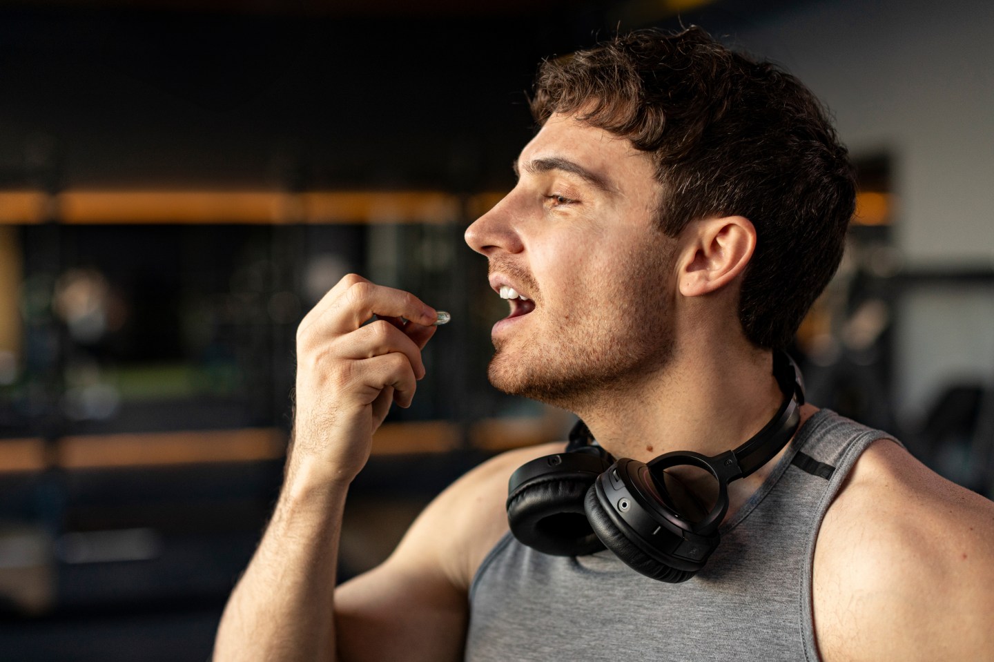 A person taking a supplement.