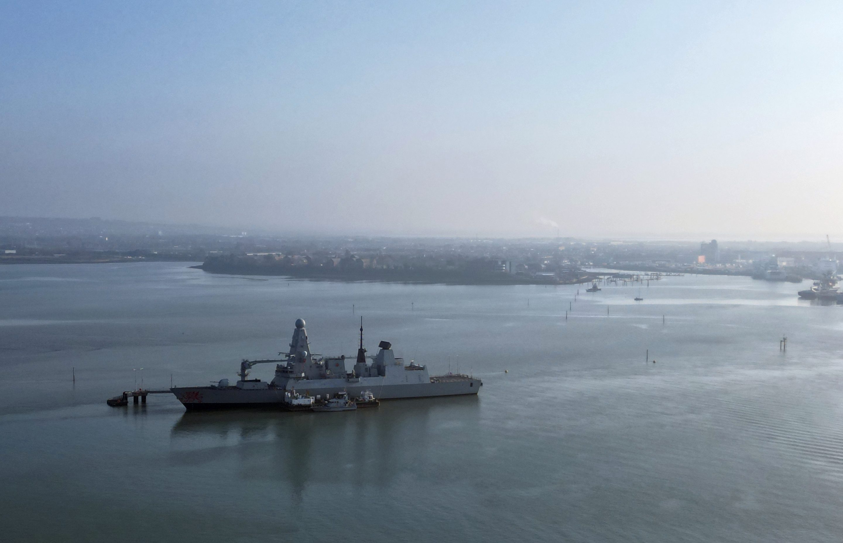 HMS Dragon, a Royal Navy Type 45 Daring-class air-defence destroyer warship, moored at the HMNB Portsmouth Upper Harbour Ammunition Facility (UHFC), outside HM Naval Base Portsmouth, pictured from Gosport, on the south coast of England, on March 4, 2026.