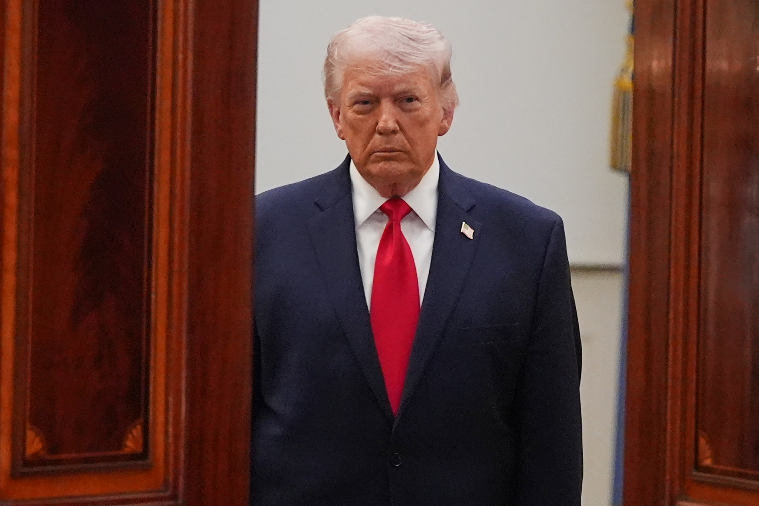 President Donald Trump arrives to speak in the Cross Hall of the White House on April 1, 2026.