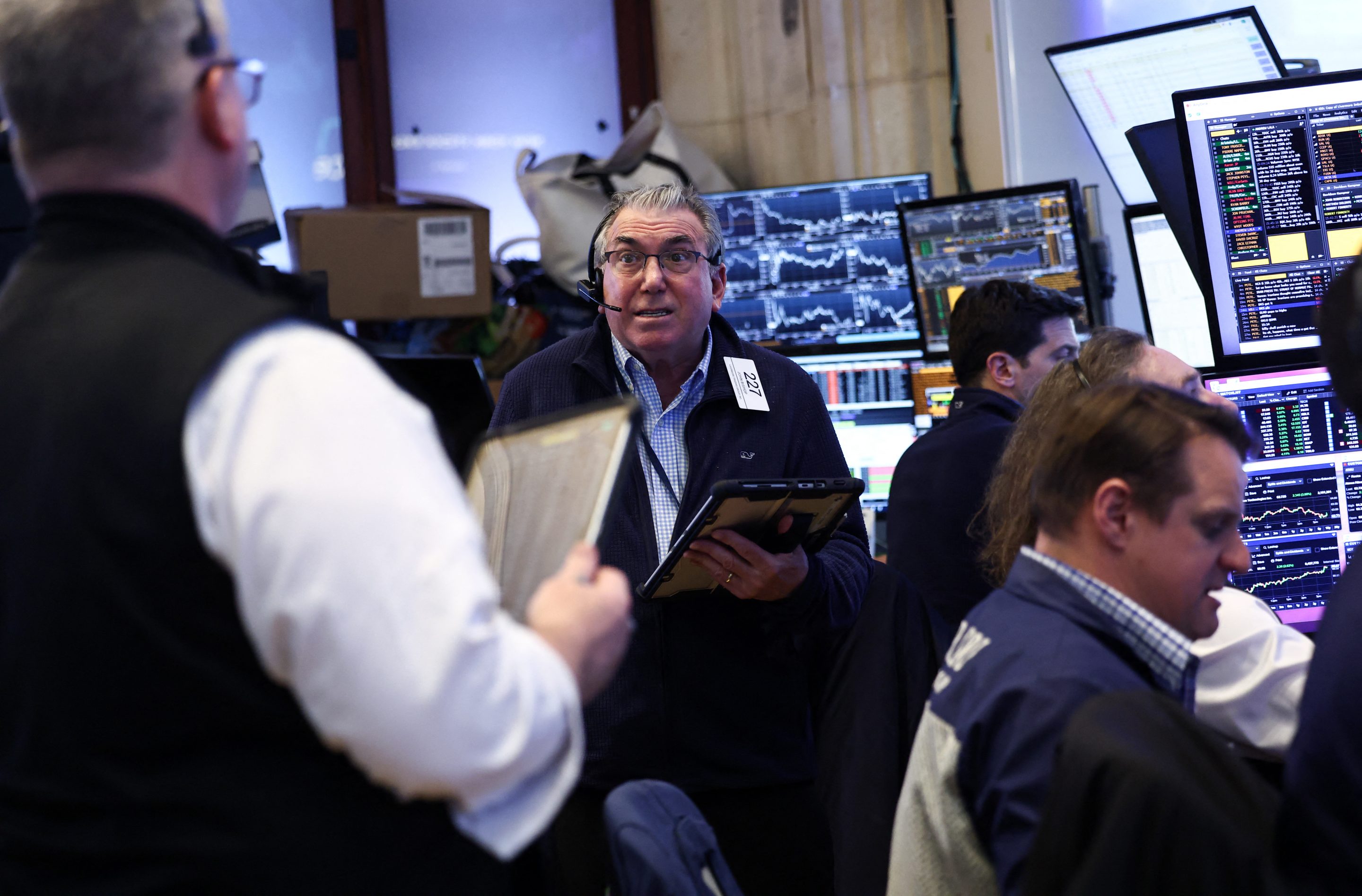 Traders work on the floor of the New York Stock Exchange (NYSE) before the closing bell in New York City on April 8, 2026.