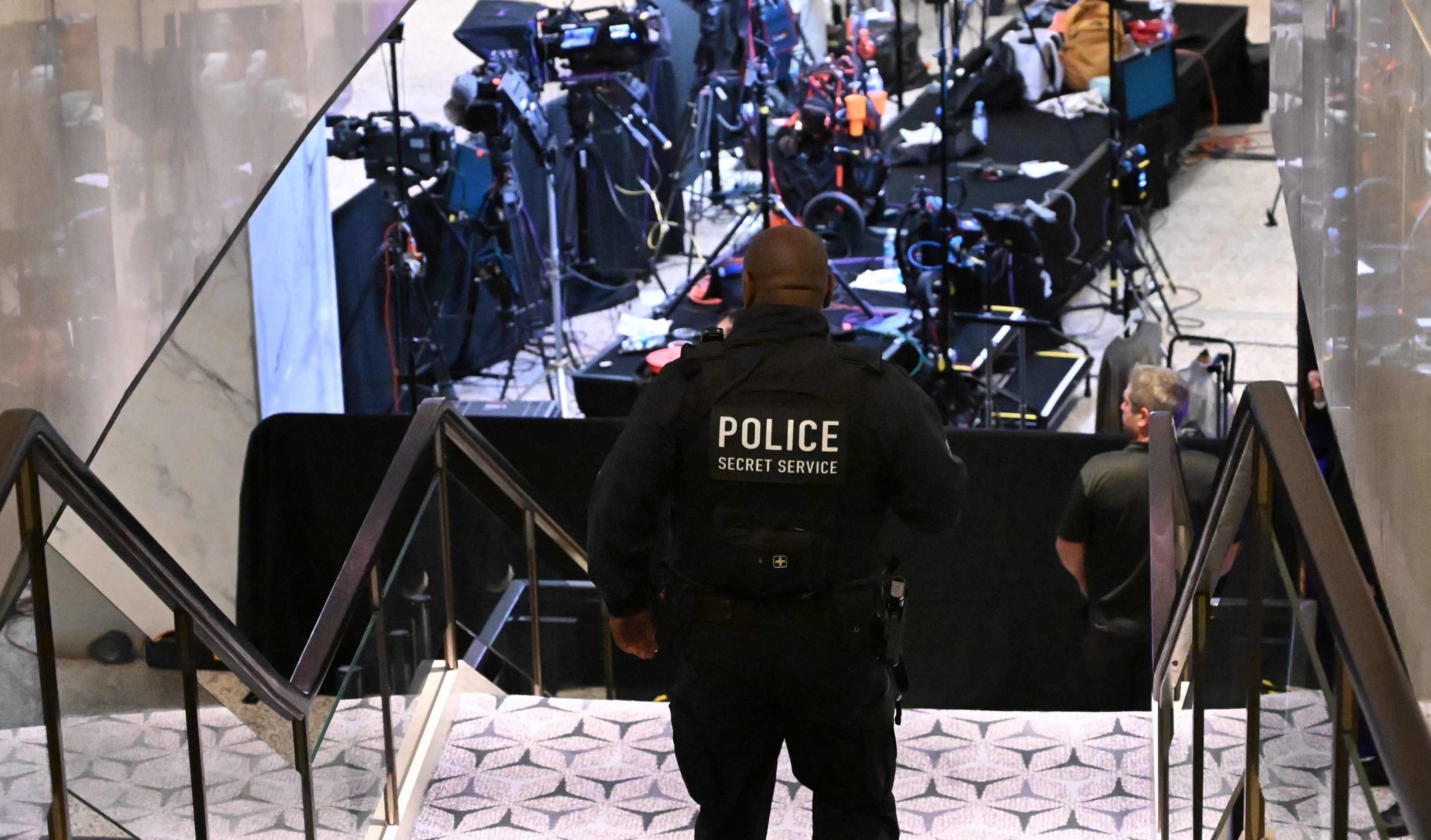 A Secret Service police officer walks through the lobby of the Washington Hilton after shots were heard during the White House Correspondents' Dinner in Washington, DC, on April 25, 2026.
