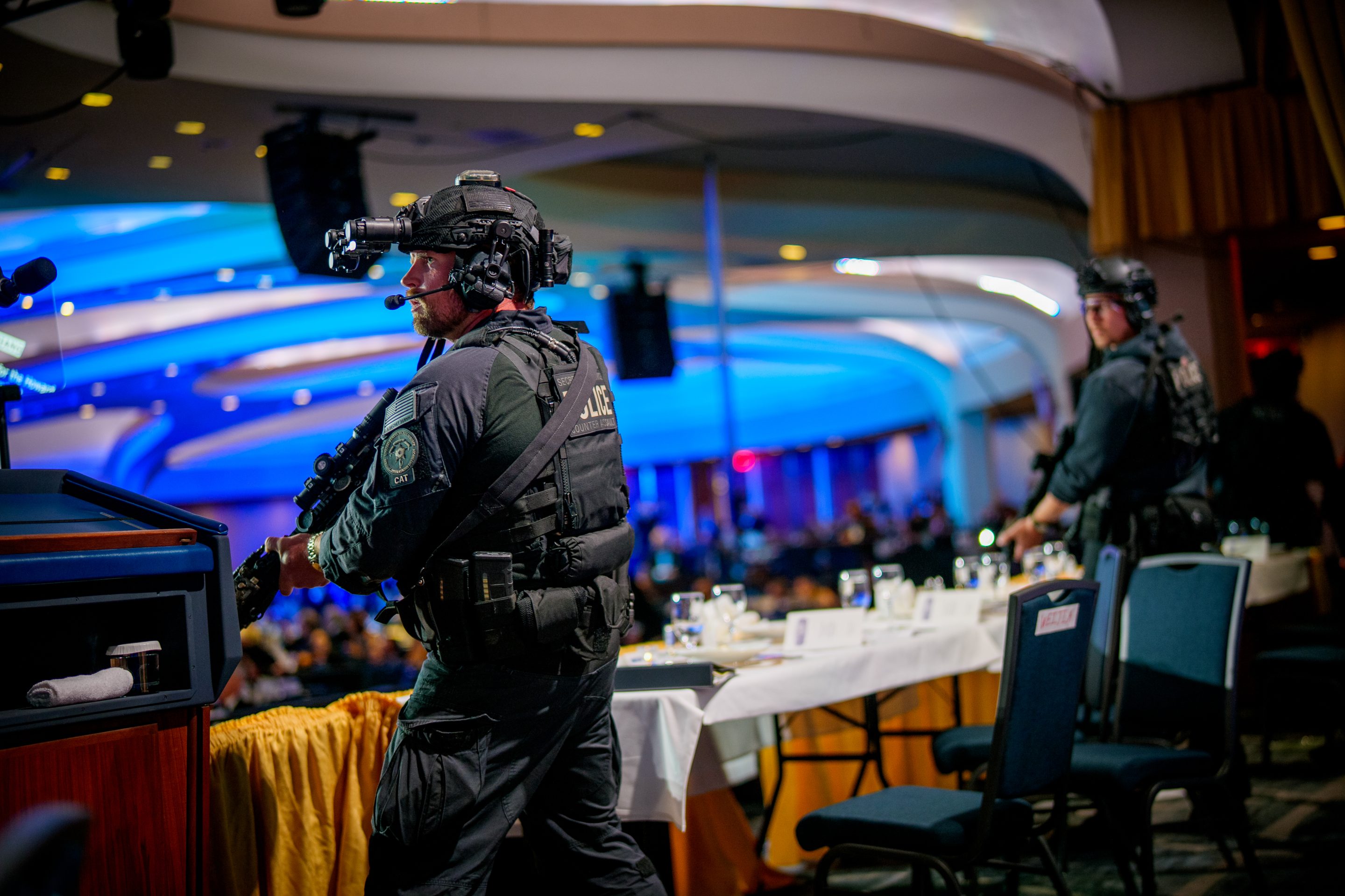 Armed Secret Service agents stand on stage during a shooting incident at the annual White House Correspondents Association Dinner at the Washington Hilton on April 25, 2026 in Washington, DC.