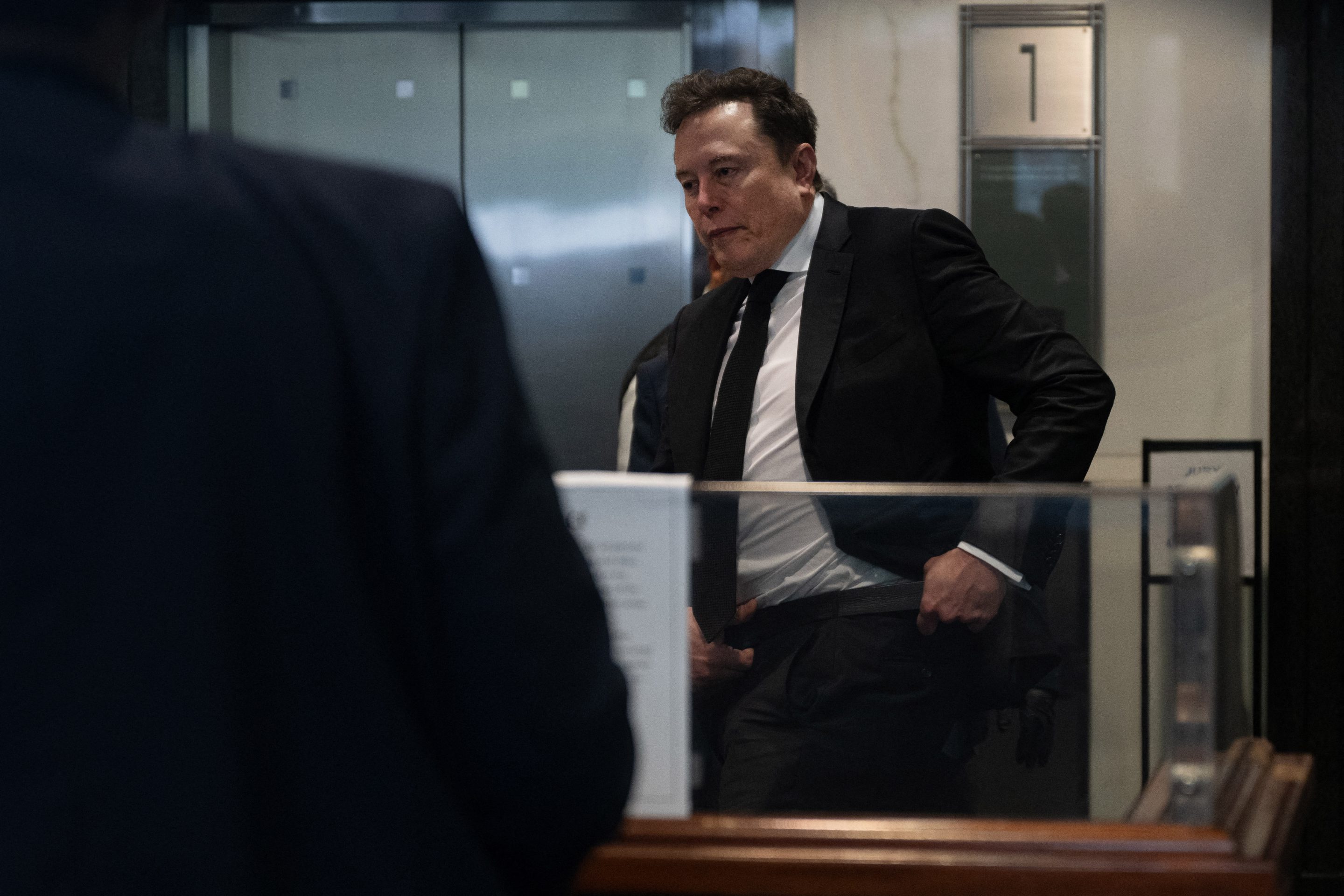 Elon Musk arrives at the federal courthouse as opening statements begin in the trial over Elon Musk's lawsuit against OpenAI in Oakland, California, on April 28, 2026.