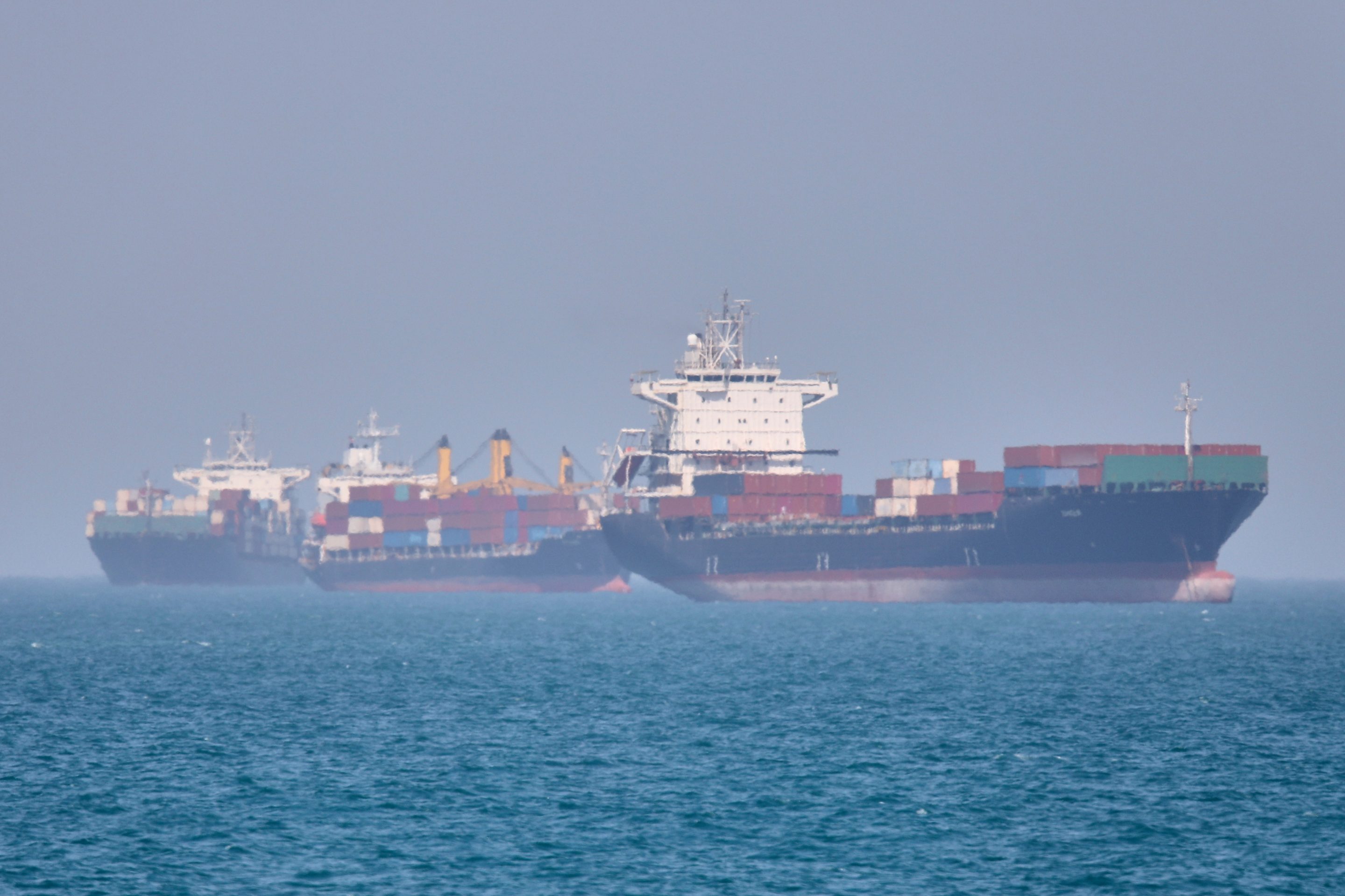 Container ships sit at anchor in the Strait of Hormuz off Bandar Abbas, Iran, Saturday, May 2, 2026.