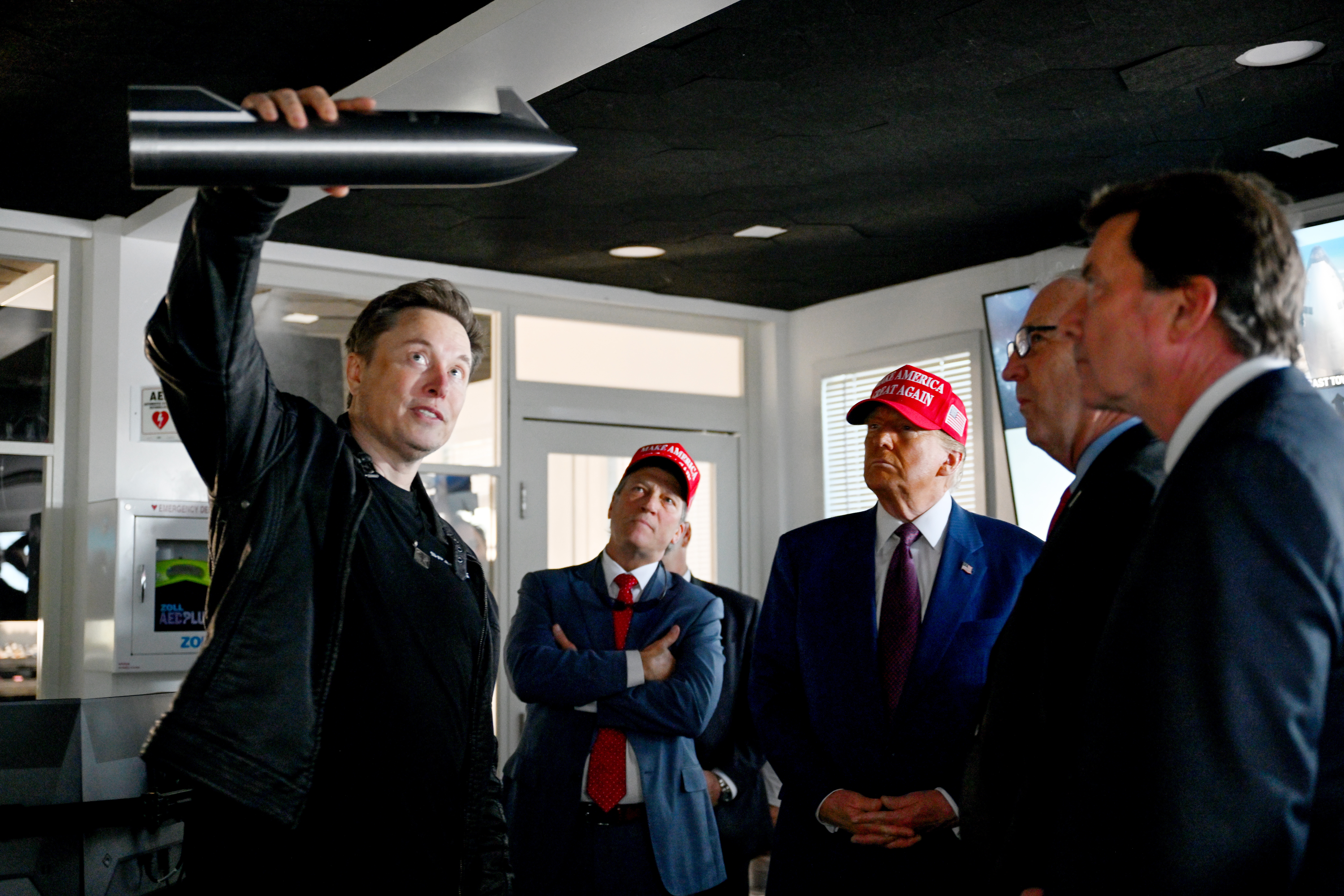 Elon Musk gives a tour to U.S. President-elect Donald Trump and lawmakers of the control room before the launch of the sixth test flight of the SpaceX Starship rocket on November 19, 2024 in Brownsville, Texas.