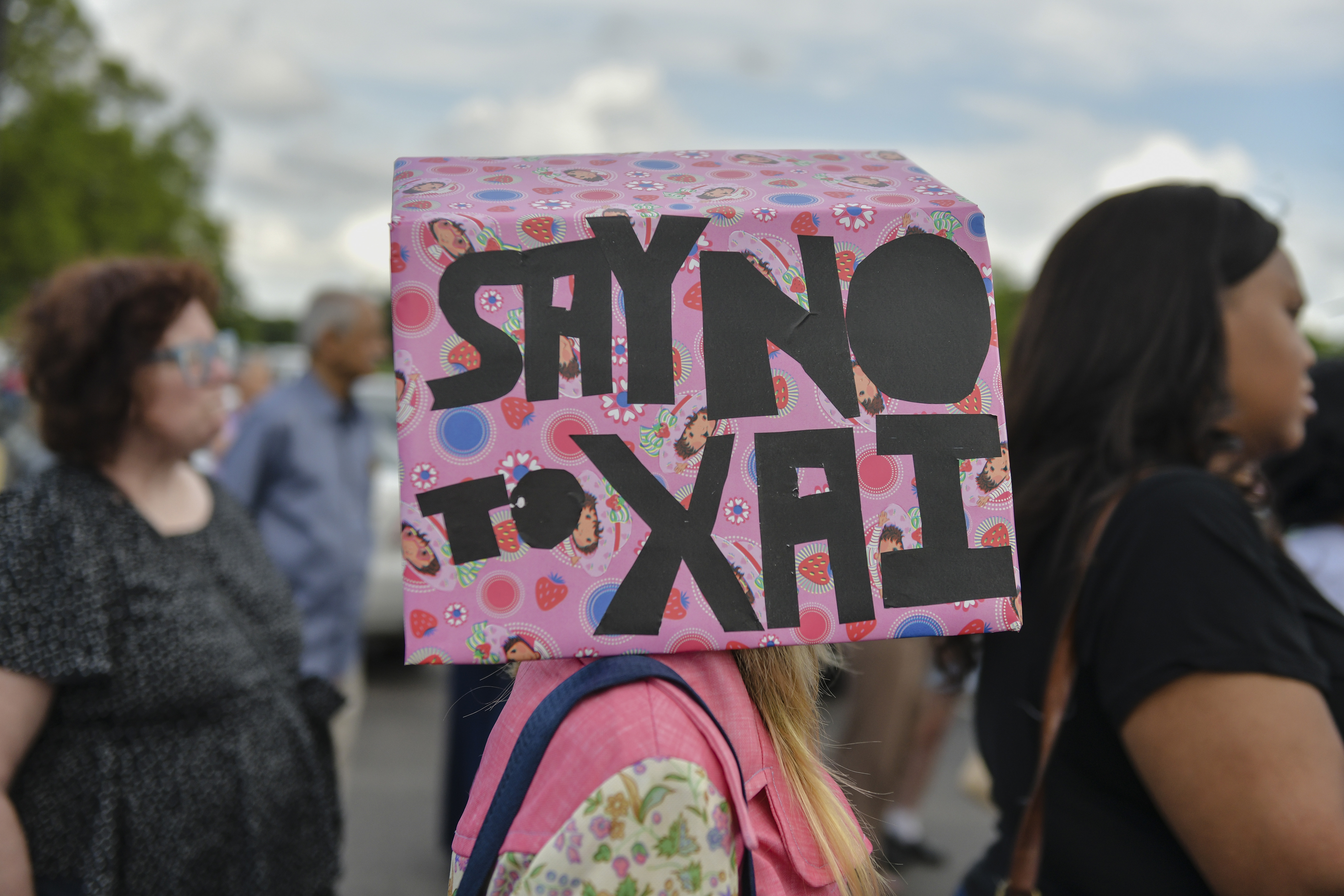 Demonstrators gather in opposition to a plan by Elon Musks's xAI to use gas turbines for a new data center during a rally outside of Fairley High School ahead of a public comment meeting on the project in Memphis, TN on April 25, 2025.