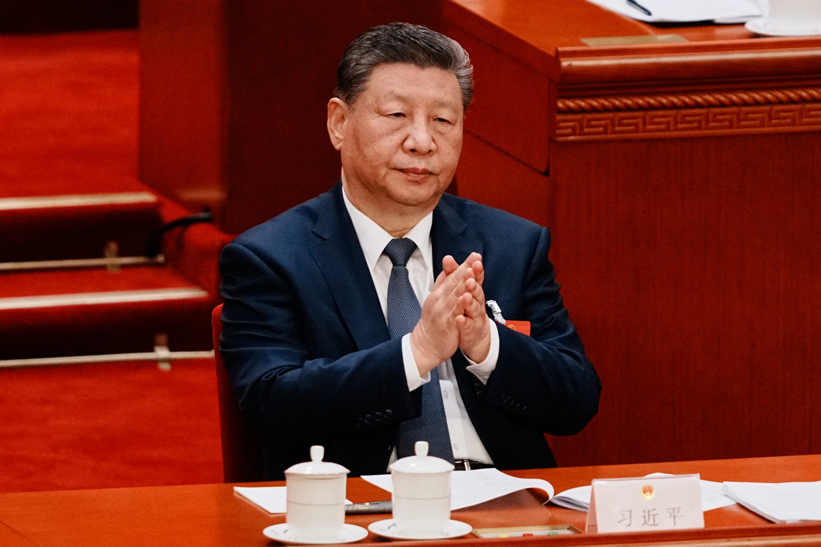 Chinese President Xi Jinping applauds during a plenary session of China’s National People’s Congress in Beijing on March 9, 2026.