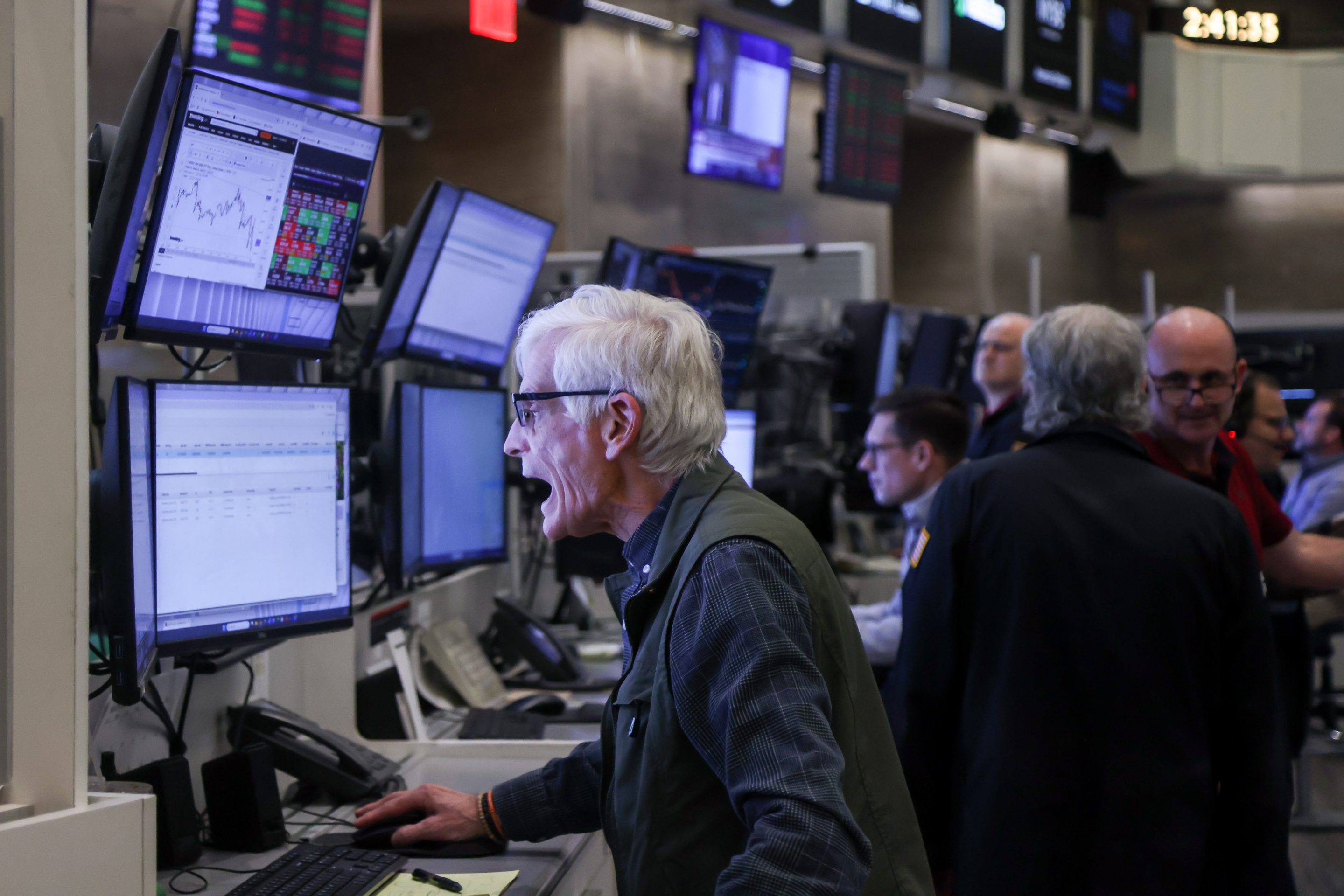 Traders work after a Federal Open Market Committee (FOMC) meeting on the floor of the New York Stock Exchange (NYSE) in New York, US, on Wednesday, March 18, 2026.