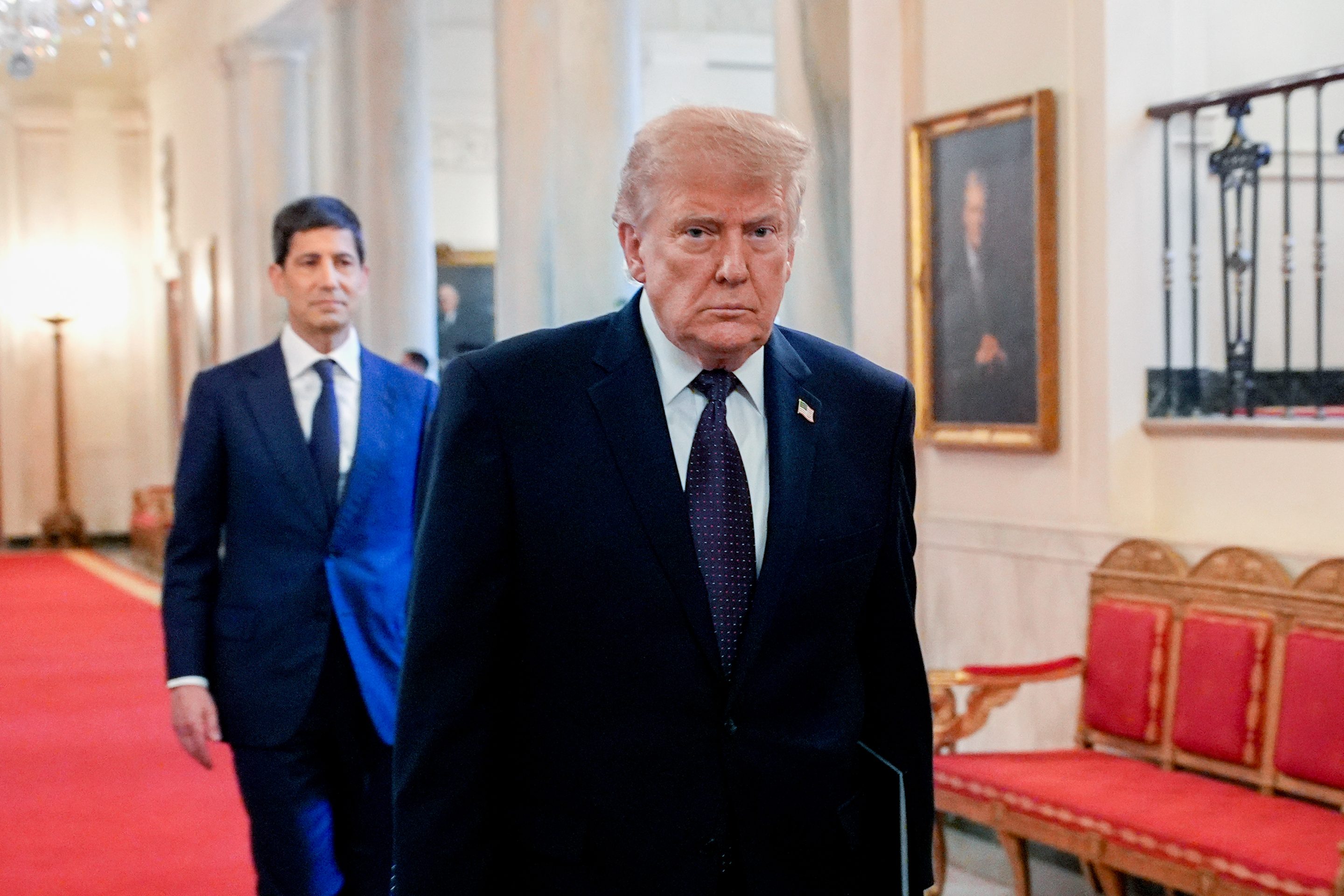 President Donald Trump, right, and Kevin Warsh arrive for a swearing-in ceremony in the East Room of the White House on Friday, May 22, 2026.