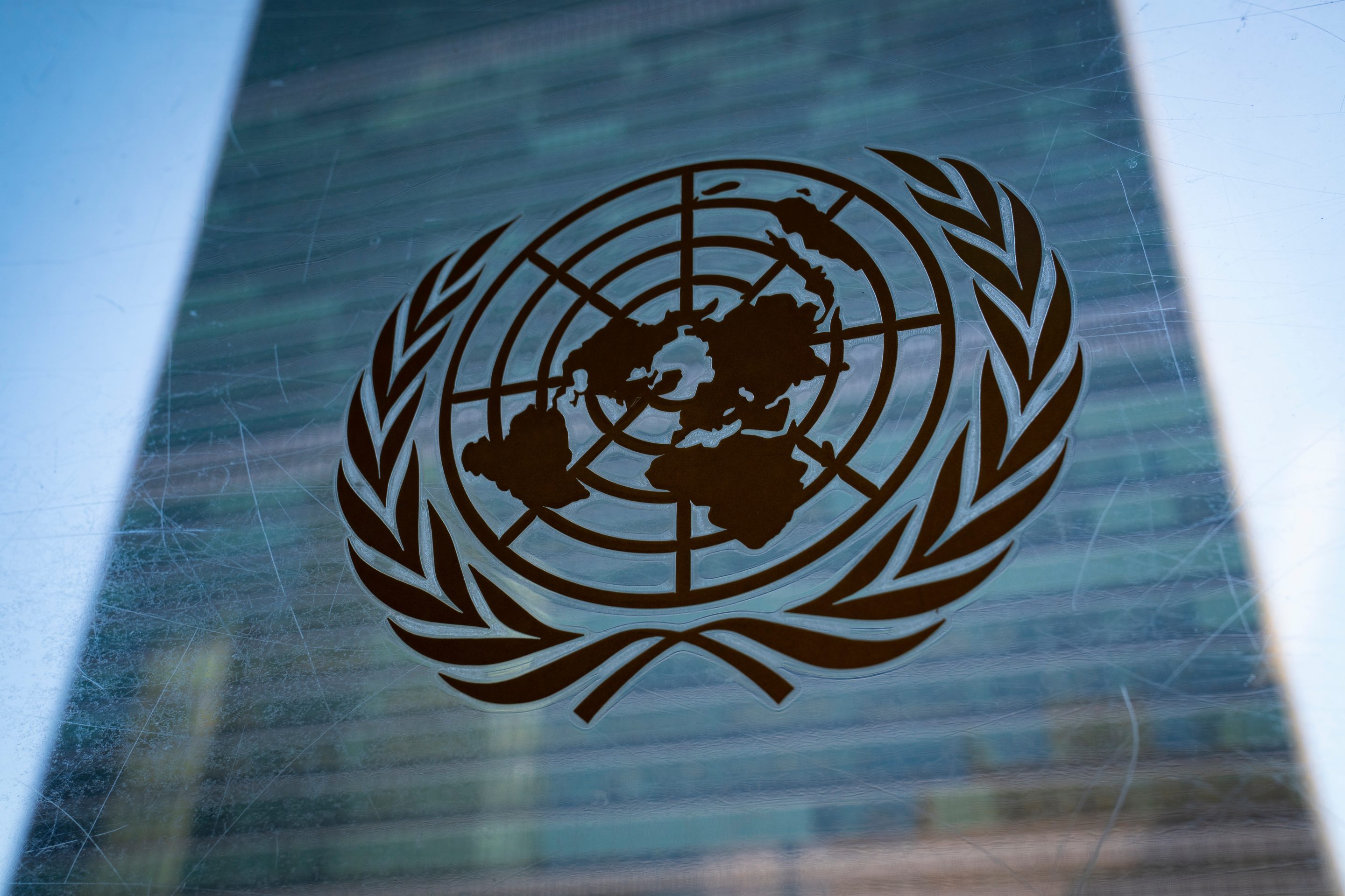 The symbol of the United Nations is displayed outside the Secretariat Building, Feb. 28, 2022, at United Nations Headquarters.