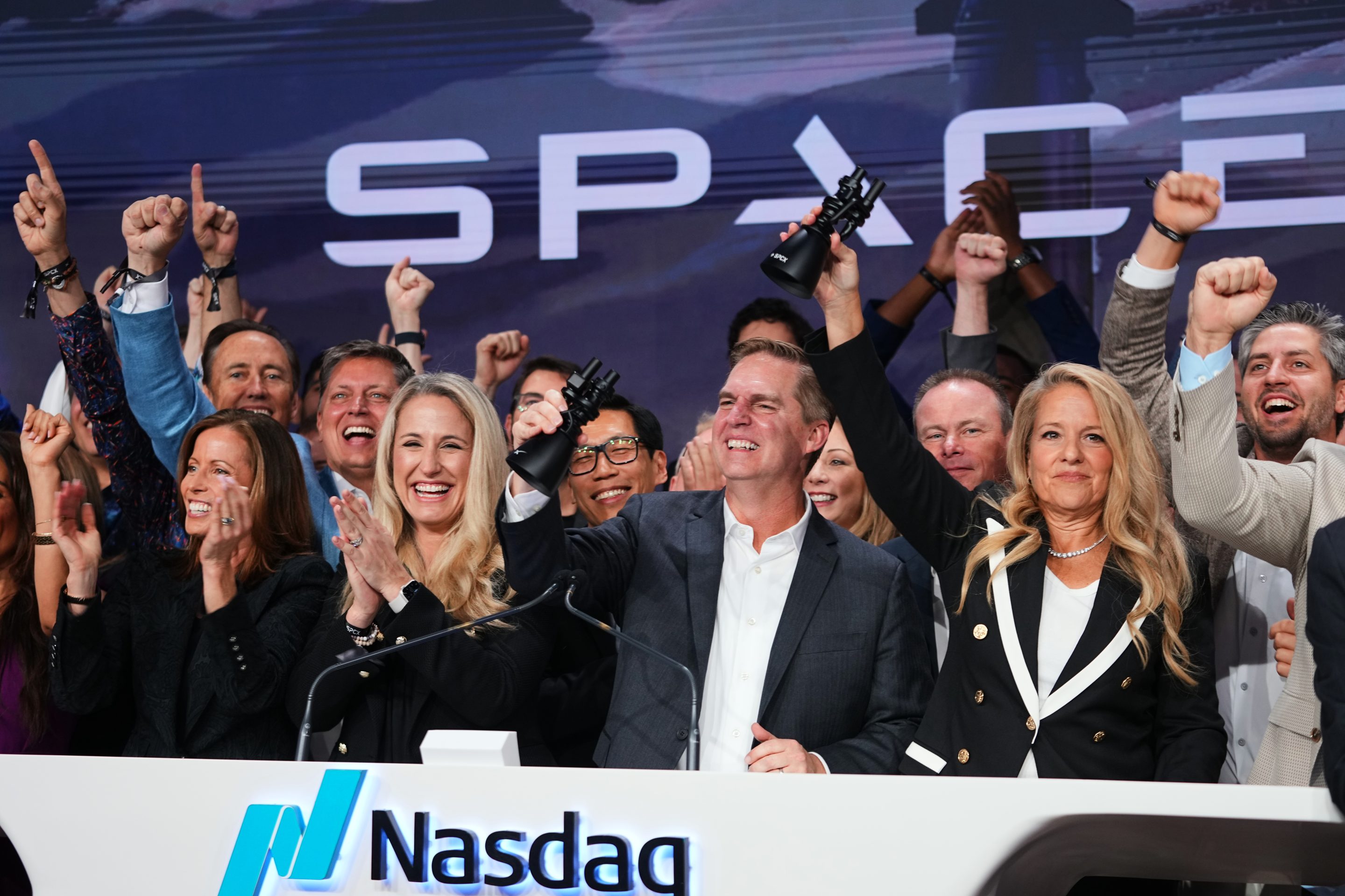 Gwynne Shotwell, President and COO of SpaceX, right, celebrates with colleagues during a bell ringing ceremony for the IPO of SpaceX at the Nasdaq MarketSite in New York, Friday, June 12, 2026, in New York.
